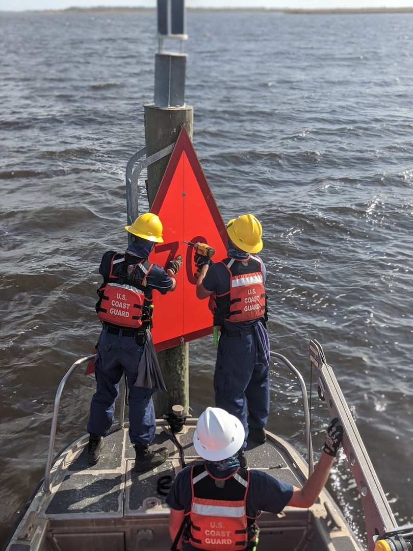 A crew form U.S. Coast Guard Aids to Navigation Team Sabine, Texas hangs new a dayboard on Lake Charles, Louisiana, Aug 31, 2020. The crew has been working to repair aids to navigation in the tributaries of the Gulf of Mexico in the wake of Hurricane Laura.
(U.S. Coast Guard photo by Petty Officer 2nd Class Ronald Hodges)
