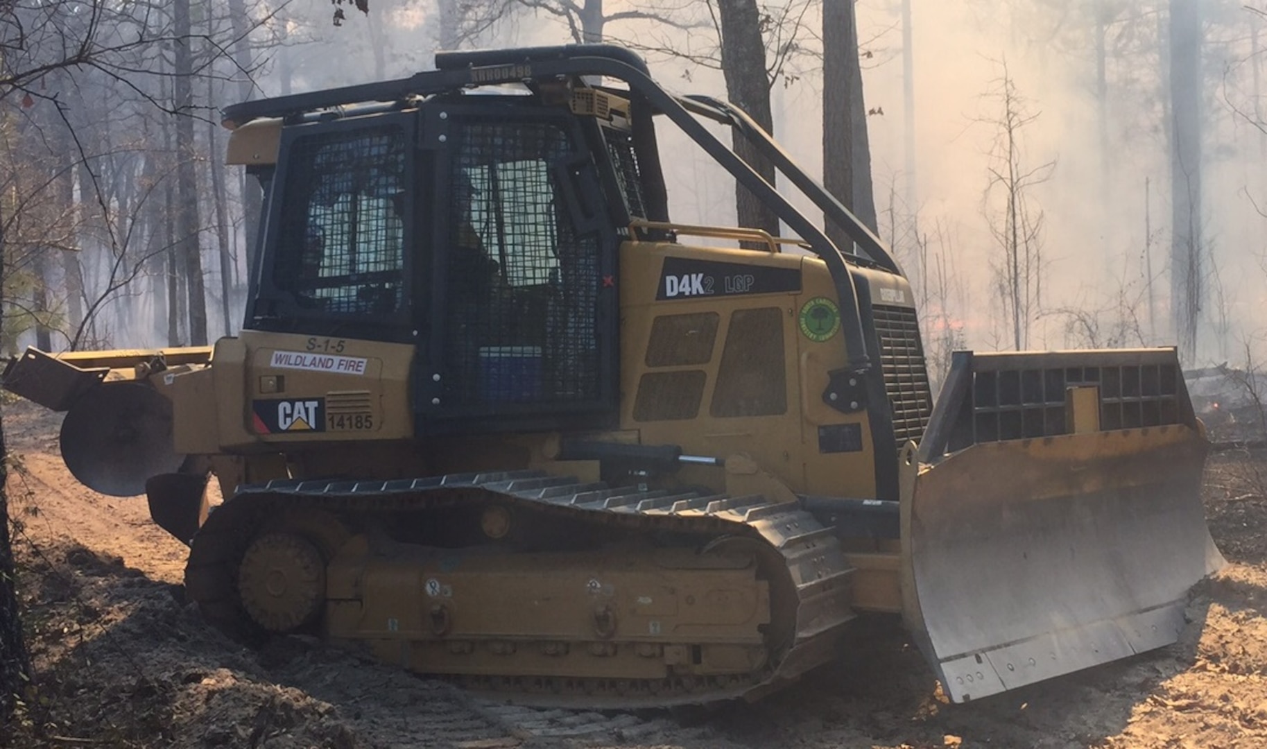 Excess hydraulic oil from Marine Corps Base Camp Lejeune, North Carolina, will help Caterpillar D4K2 Firefighting Dozers used by the South Carolina Forestry Commission deal with the extreme conditions that occur during while putting out fires, which can damage to hydraulic hoses and fittings.