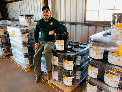 Equipment & Fleet Manager Doug Mills accepts 162 five-gallon cans of excess hydraulic oil from Marine Corps Base Camp Lejeune, North Carolina, to support the South Carolina Forestry Commission’s Caterpillar D4K2 Firefighting Dozers.