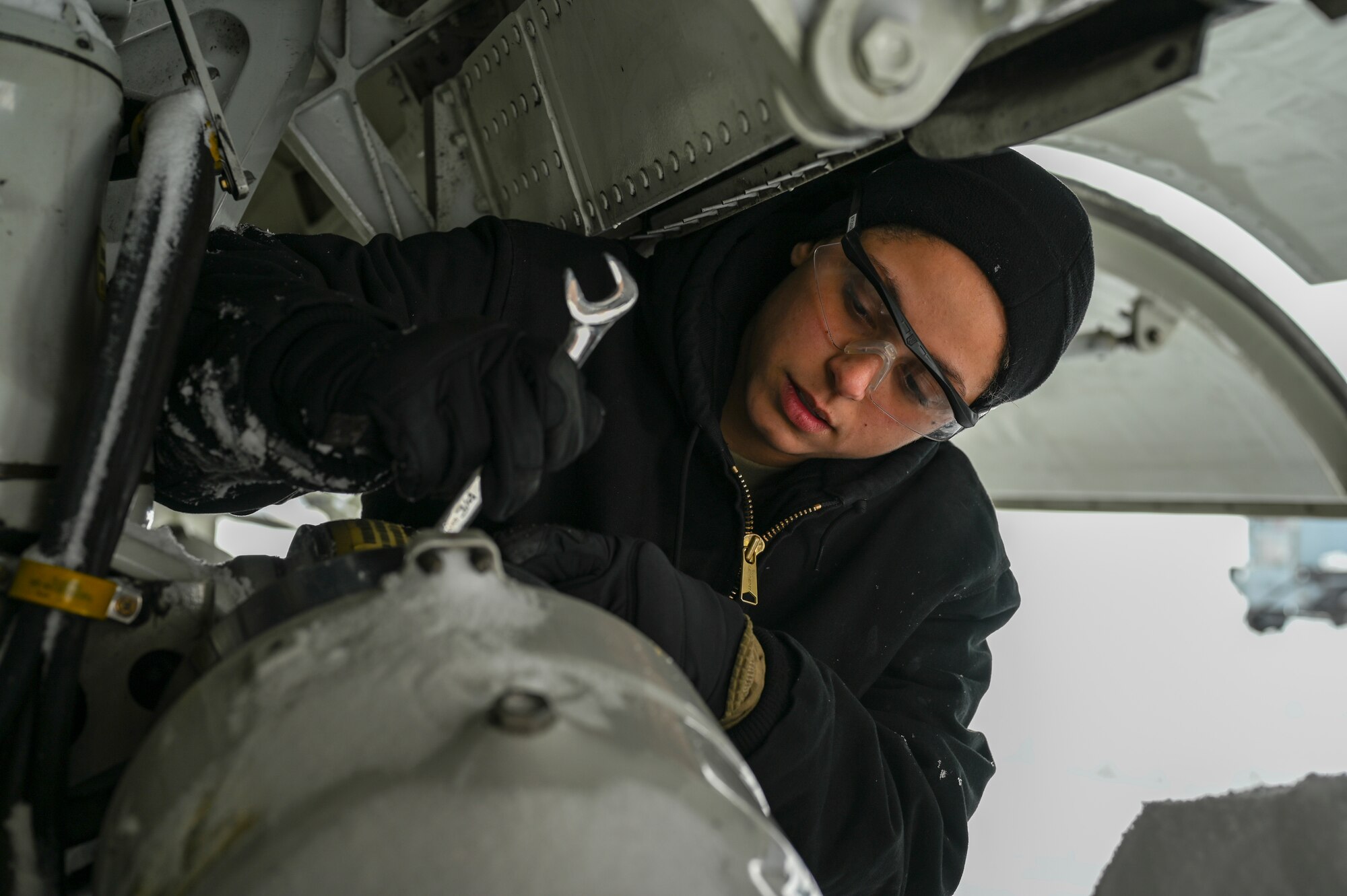 Senior Airman Kendra Ancell, hydraulics technician with the 911th Aircraft Maintenance Squadron, conducts routine maintenance on the landing gear strut of a C-17 Globemaster III at the Pittsburgh International Airport Air Reserve Station, Pennsylvania, Feb. 1, 2021.