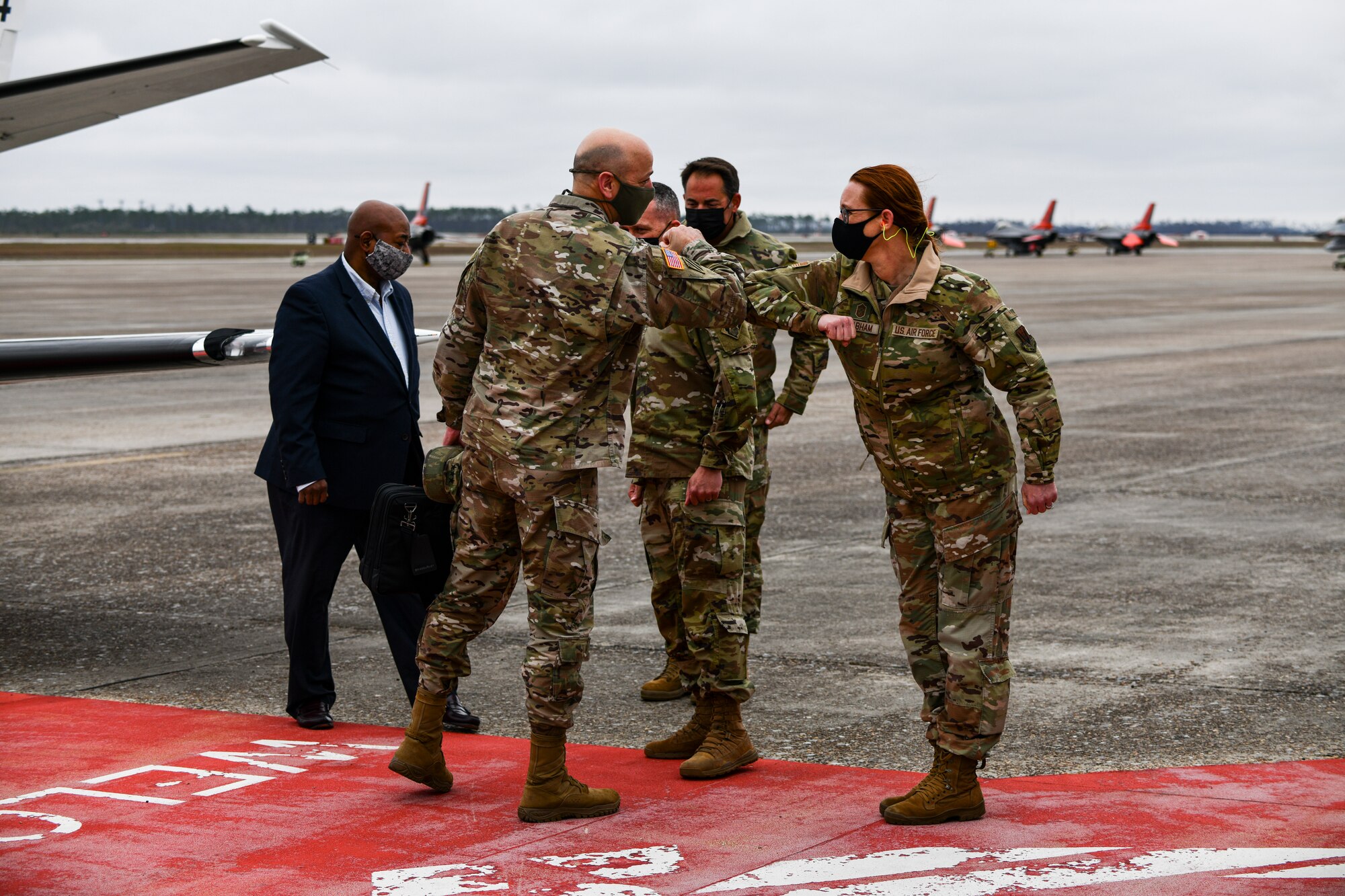 U.S. Army Lt. Gen. Scott A. Spellmon, Commanding General of the U.S. Army Corps of Engineers, greets U.S. Air Force Chief Master Sgt. Katie Grabham, 325th Fighter Wing command chief, at Tyndall Air Force Base, Florida, March 2, 2021. Spellmon visited Tyndall to engage with leadership and gain a better understanding of  strategic objectives. (U.S. Air Force photo by Staff Sgt. Stefan Alvarez)