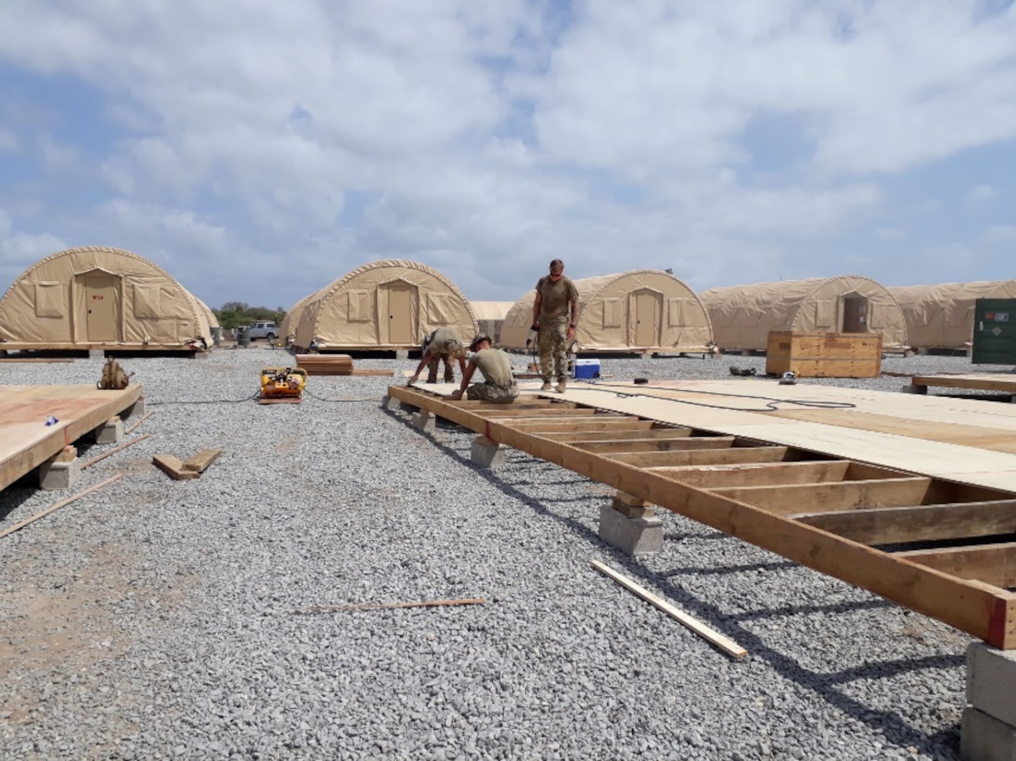 Airmen from the 435th Air Ground Operations Wing and 435th Air Expeditionary Wing execute a short-notice tasker to build-out a base capability in East Africa, Dec. 29, 2020. In addition to the build-out the Airmen repurposed three sleeping buildings into office spaces, expanded kitchen operations by 1,000 square feet, and constructed new fire department berthing tents and an alarm room.