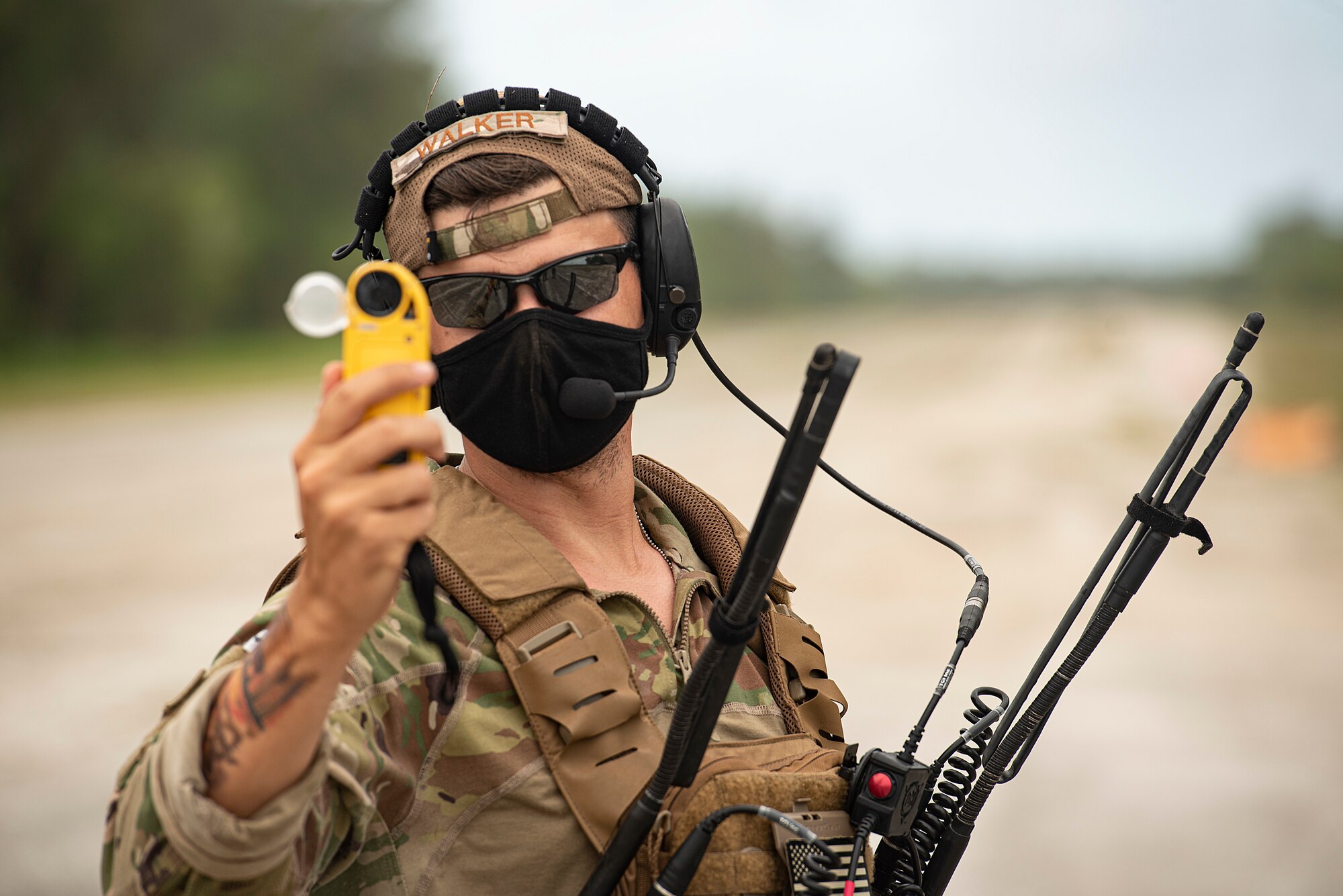 U.S. Air Force Capt. Gene Walker, 36th Contingency Response Squadron assistant director of operations, measures wind speed moments before an aircraft landing during Cope North 21, Feb. 11, 2021, on Angaur, Palau.