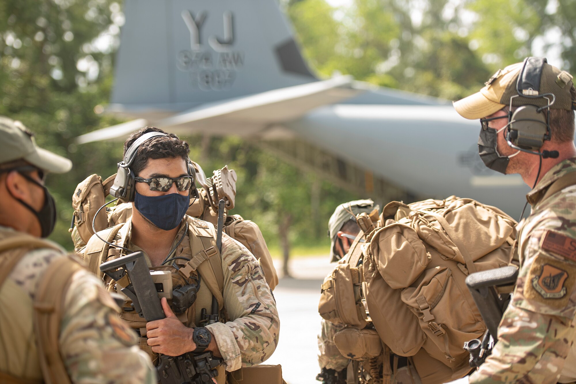 U.S. Air Force defenders from the 736th Security Forces Squadron, assigned to Andersen Air Force Base, Guam, gather moments before boarding a C-130J Super Hercules, assigned to Yokota Air Base, Japan, during Cope North 21, Feb. 11, 2021, on Angaur, Palau.