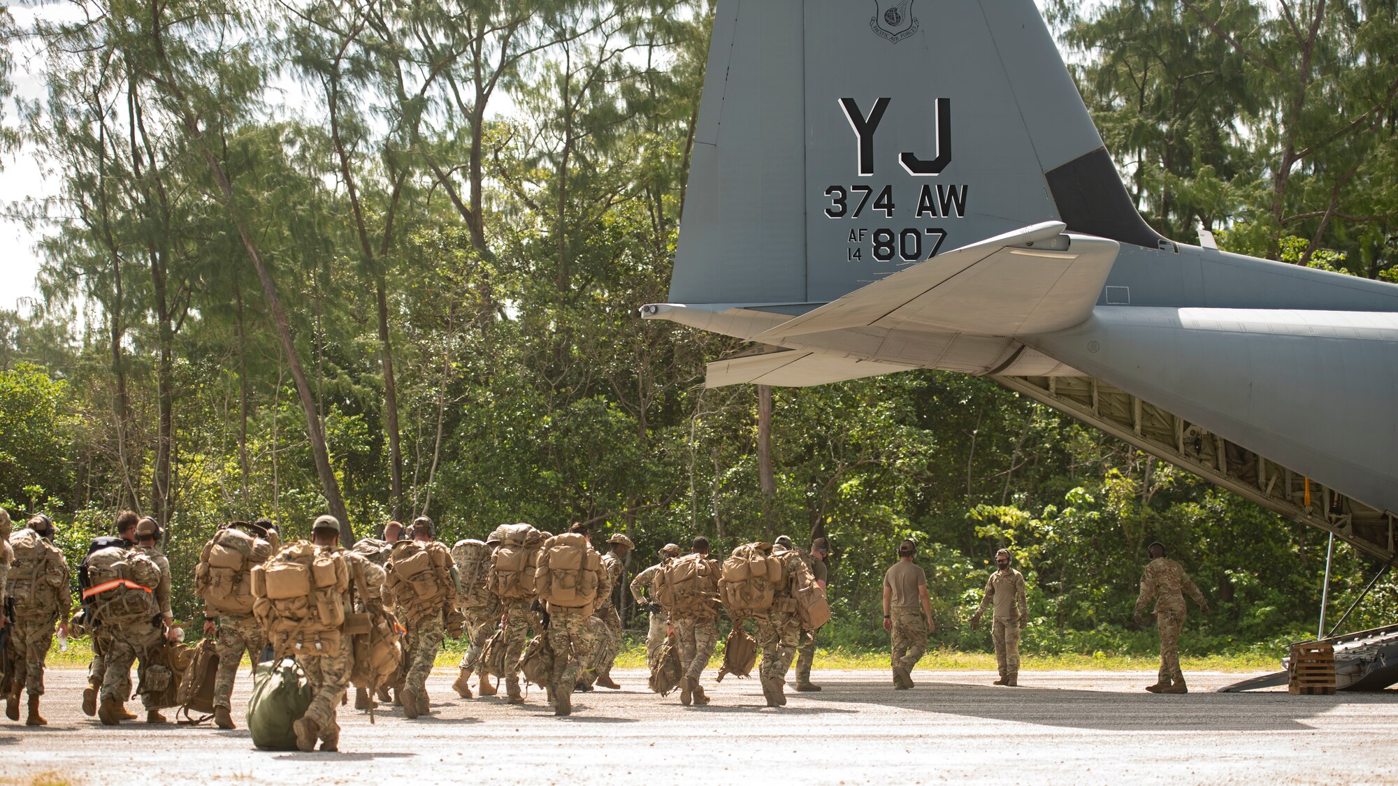 U.S. Air Force defenders from the 736th Security Forces Squadron, assigned to Andersen Air Force Base, Guam, board a C-130J Super Hercules, assigned to Yokota Air Base, Japan, during Cope North 21, Feb. 11, 2021, on Angaur, Palau.