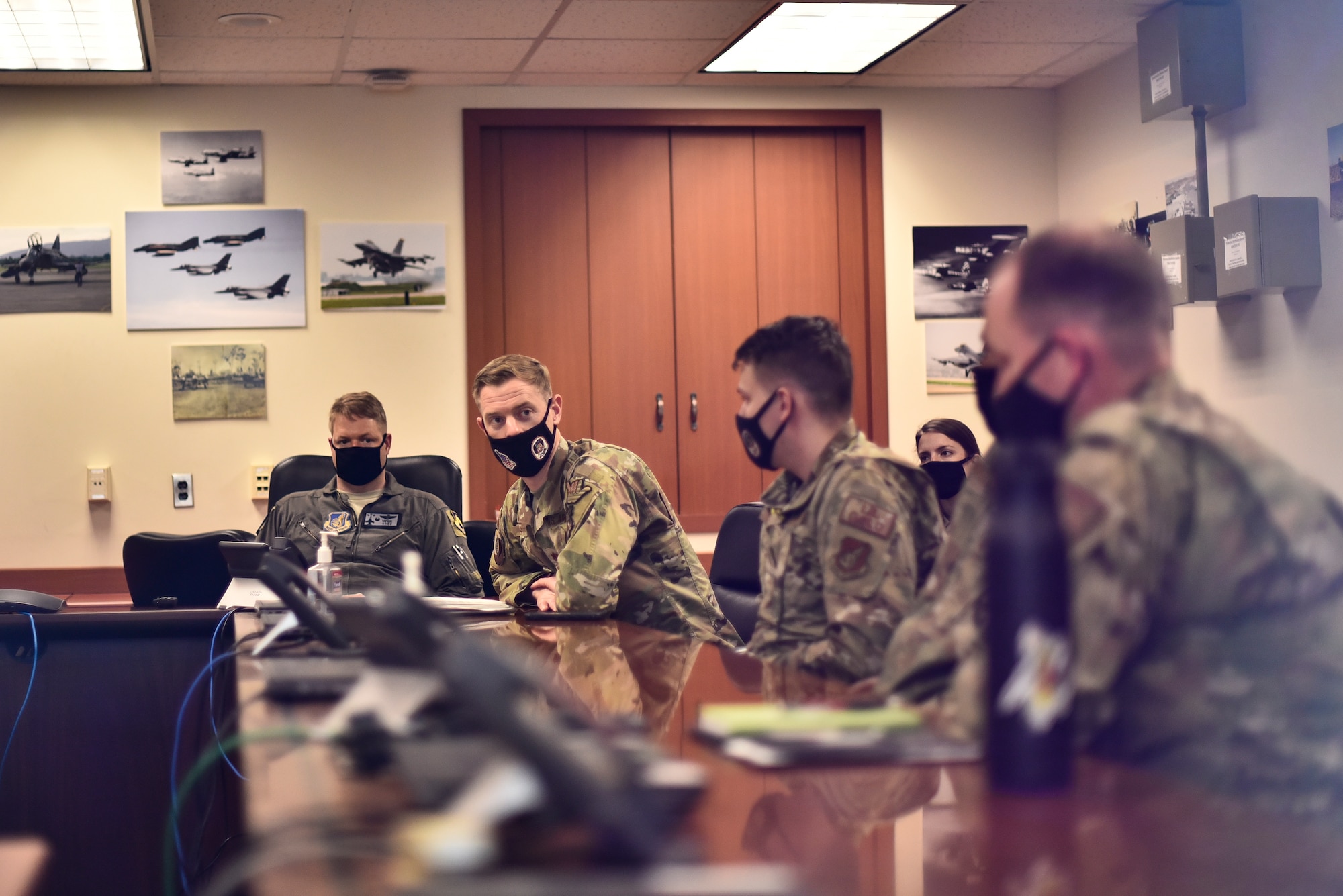 An Airman speaks during a briefing.