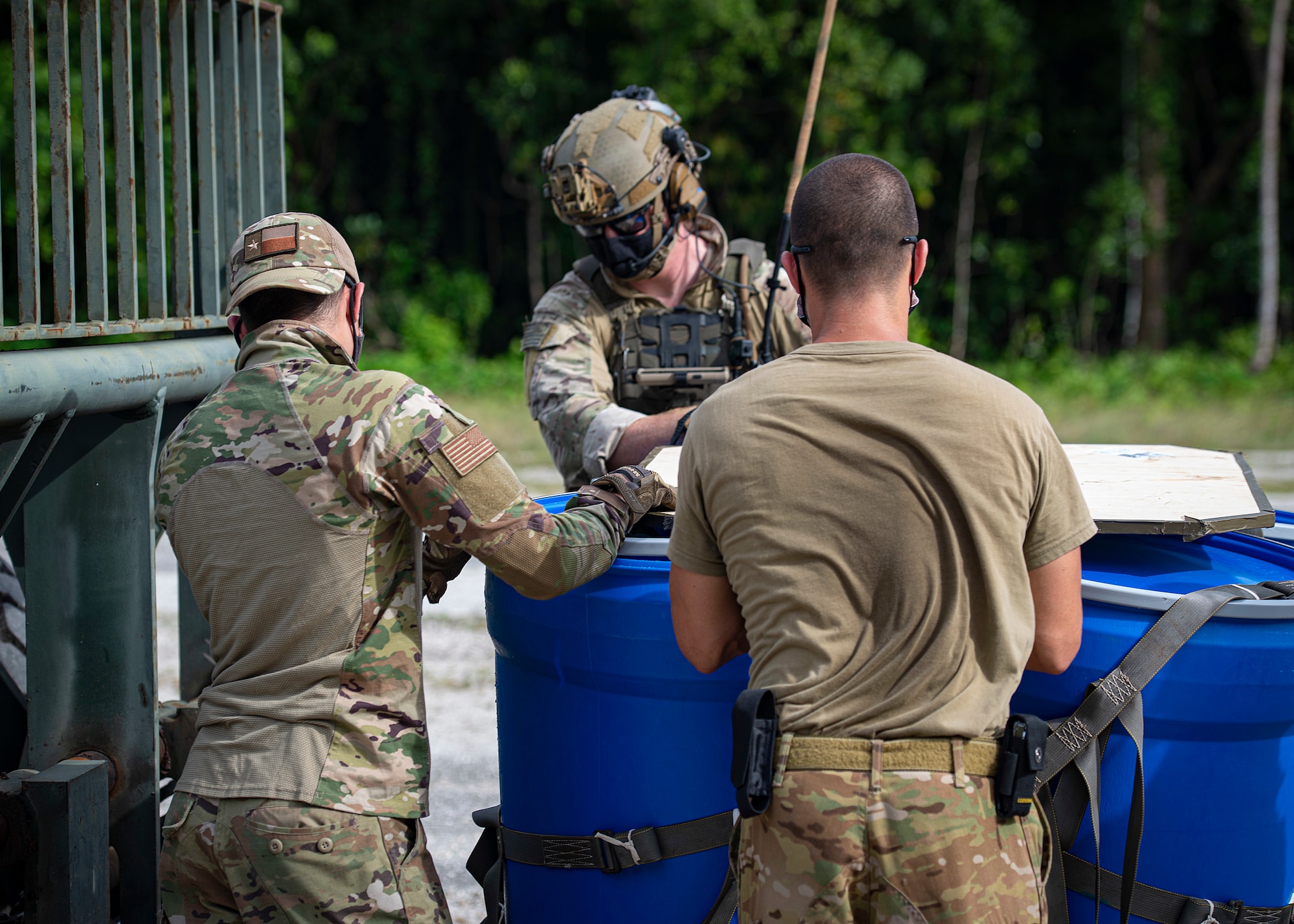 U.S. Air Force Airmen assigned to the 36th Contingency Response Group secure an airdropped package to a forklift to be transported during Cope North 21, Feb. 10, 2021, on Angaur, Palau.