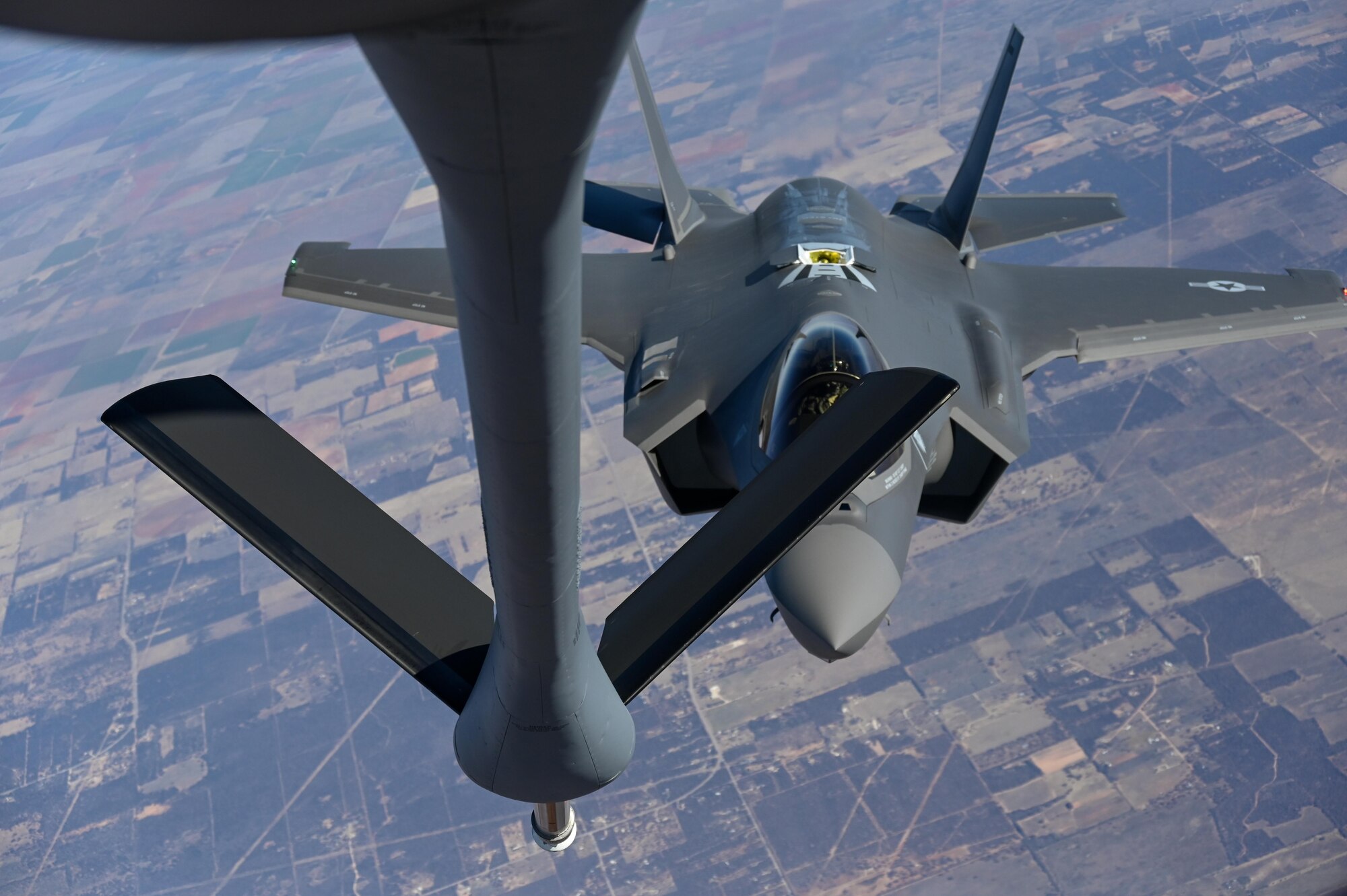 An F-35 Lightning II from the Defense Contract Maintenance Agency conducts its first flight and first tanking with a KC-135R Stratotanker from the 465th Air Refueling Squadron, Tinker Air Force Base, Oklahoma, Feb. 24, 2021. Once fully tested this F-35 will join the fleet at Eielson Air Force Base, Alaska. (U.S. Air Force photo by Senior Airman Mary Begy)
