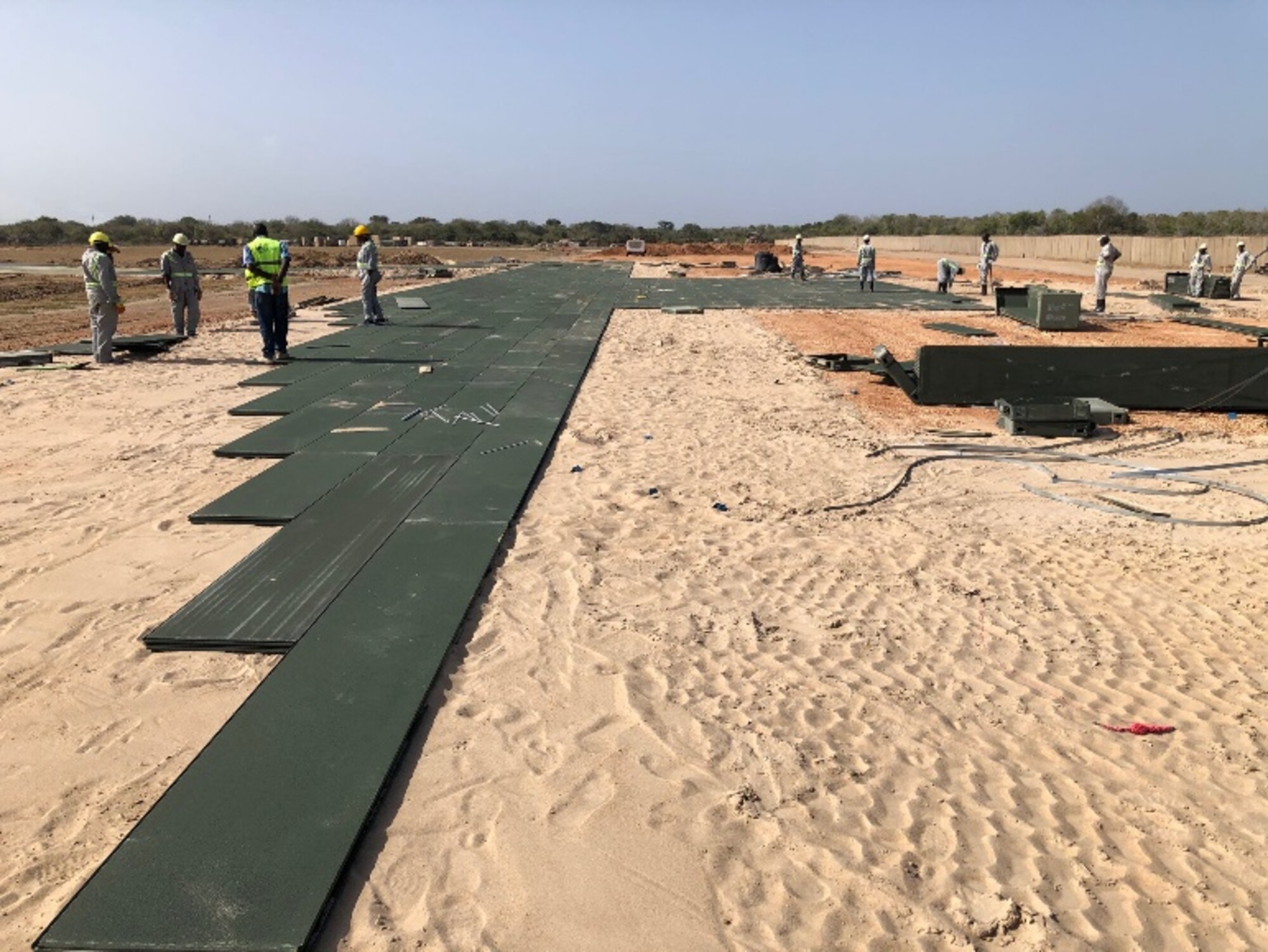 Contractors build helicopter pads to support a base build-out tasker in support of Operation Octave Quartz at a base in East Africa, Dec. 23, 2020. The objective of OOQ was to re-posture assets and personnel within Somalia to other locations within the region at the direction of the President of the United States and the acting Secretary of Defense. (Courtesy Photo)