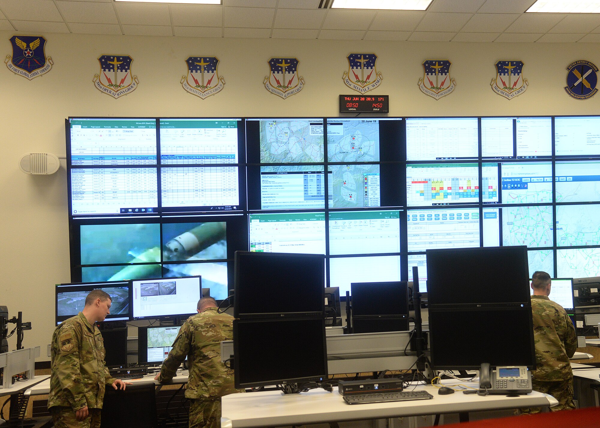 Airmen at Malmstrom Air Force Base, Montana, prepare for a ribbon cutting ceremony to officially open the 341st Missile Wing’s Operations Center June 20, 2019.