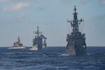 PACIFIC OCEAN (Feb. 28, 2021) – The Japan Maritime Self-Defense Force (JMSDF) Hatakaze-class destroyer JDS Hatakaze (TV 3520), front, Ticonderoga-class guided-missile cruiser USS Bunker Hill (CG 52), center, JMSDF Hatsuyuki-class destroyer JDS Setoyuki (TV 3518), left, and JMSDF Asagiri-class destroyer JDS Yugiri (DD 153) transit the Pacific Ocean Feb. 28, 2021. Bunker Hill, part of the Theodore Roosevelt Carrier Strike Group, is on a scheduled deployment to the U.S. 7th Fleet area of operations. As the U.S. Navy’s largest forward-deployed fleet, 7th Fleet routinely operates and interacts with 35 maritime nations while conducting missions to preserve and protect a free and open Indo-Pacific Region. (U.S. Navy photo by Mass Communication Specialist 3rd Class Erik Melgar)