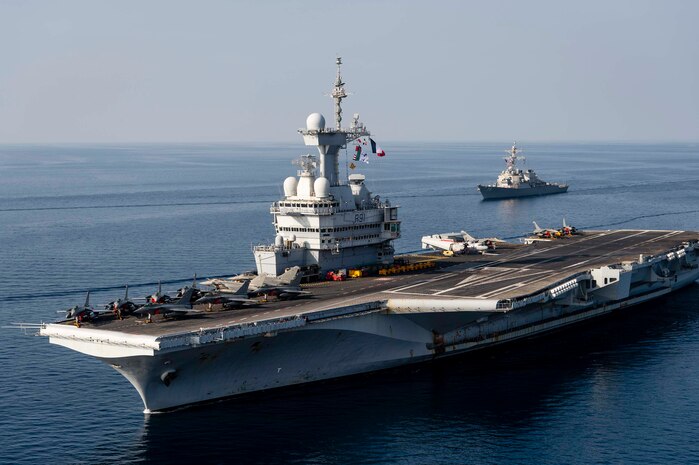 MEDITERRANEAN SEA (Feb. 28, 2021) The FS Charles De Gaulle (R 91) Carrier Strike Group sails in formation along with the Arleigh Burke-class guided-missile destroyer USS Donald Cook (DDG 75), during a photo exercise, Feb. 28, 2021. Donald Cook, forward-deployed to Rota, Spain, is on patrol in the U.S. Sixth Fleet area of operations in support of regional allies and partners and U.S. national security in Europe and Africa. (U.S. Navy photo courtesy French Navy)