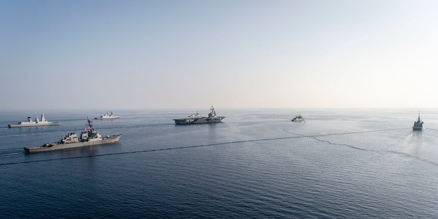 MEDITERRANEAN SEA (Feb. 28, 2021) The FS Charles De Gaulle (R 91) Carrier Strike Group sails in formation along with the Arleigh Burke-class guided-missile destroyer USS Donald Cook (DDG 75), during a photo exercise, Feb. 28, 2021. Donald Cook, forward-deployed to Rota, Spain, is on patrol in the U.S. Sixth Fleet area of operations in support of regional allies and partners and U.S. national security in Europe and Africa. (U.S. Navy photo courtesy French Navy)
