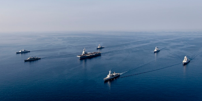 MEDITERRANEAN SEA (Feb. 28, 2021) The FS Charles De Gaulle (R 91) Carrier Strike Group sails in formation along with the Arleigh Burke-class guided-missile destroyer USS Donald Cook (DDG 75), during a photo exercise, Feb. 28, 2021. Donald Cook, forward-deployed to Rota, Spain, is on patrol in the U.S. Sixth Fleet area of operations in support of regional allies and partners and U.S. national security in Europe and Africa. (U.S. Navy photo courtesy French Navy)