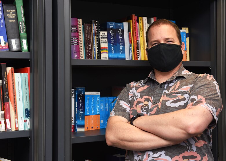 Trent Robertson, 488th Intelligence Squadron command language program manager, poses for a photo at the Language Learning Center at Royal Air Force Mildenhall, England, Feb. 26, 2021. The LLC, formerly just used for linguists within the 488th IS and 95th Reconnaissance Squadron, is now open to Airmen and civilians at RAF Mildenhall, RAF Lakenheath and RAF Feltwell. (U.S. Air Force photo by Karen Abeyasekere)