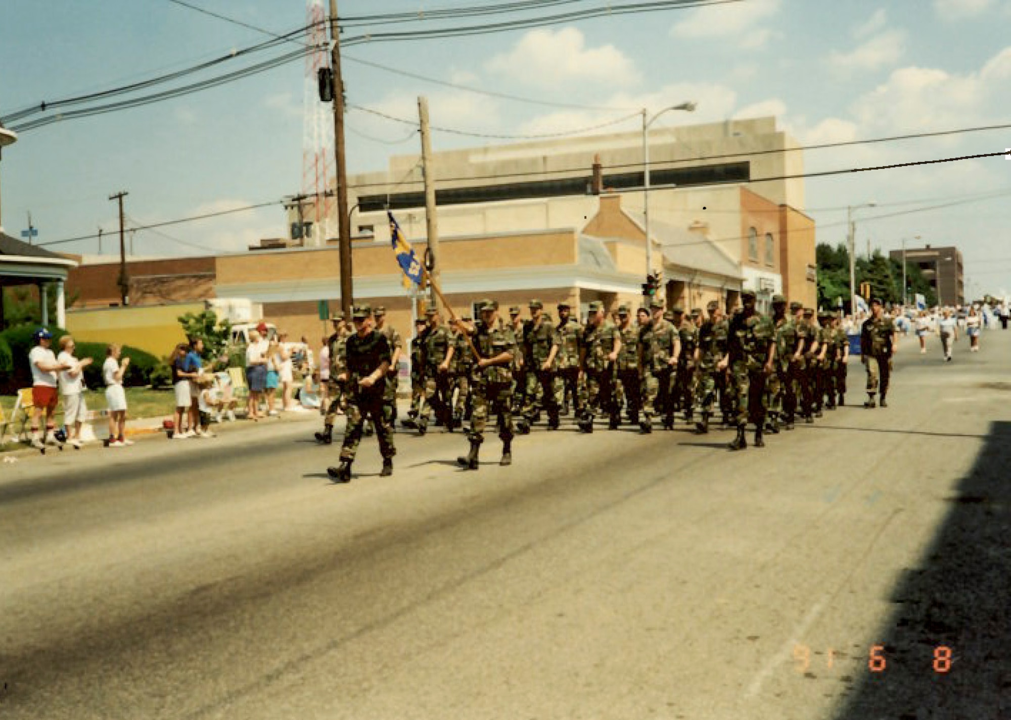 Air Force Reserve members march in a welcome home parade in downtown Bellville, Ill. after returning from deployment in support of Operation Desert Storm in 1991. (U.S. Air Force photo provided)