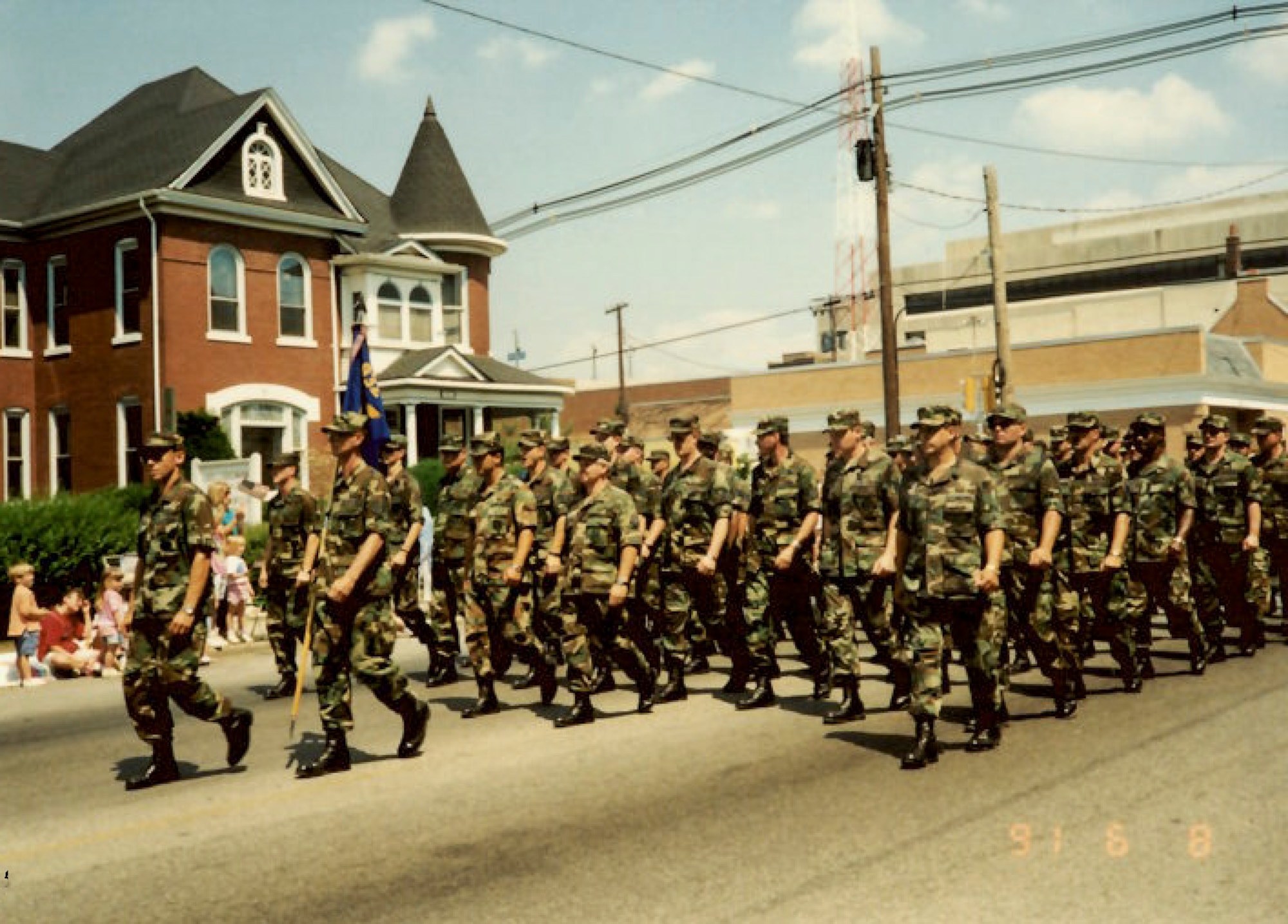 Air Force Reserve members march in a welcome home parade in downtown Bellville, Ill. after returning from deployment in support of Operation Desert Storm in 1991.(U.S. Air Force photo provided)