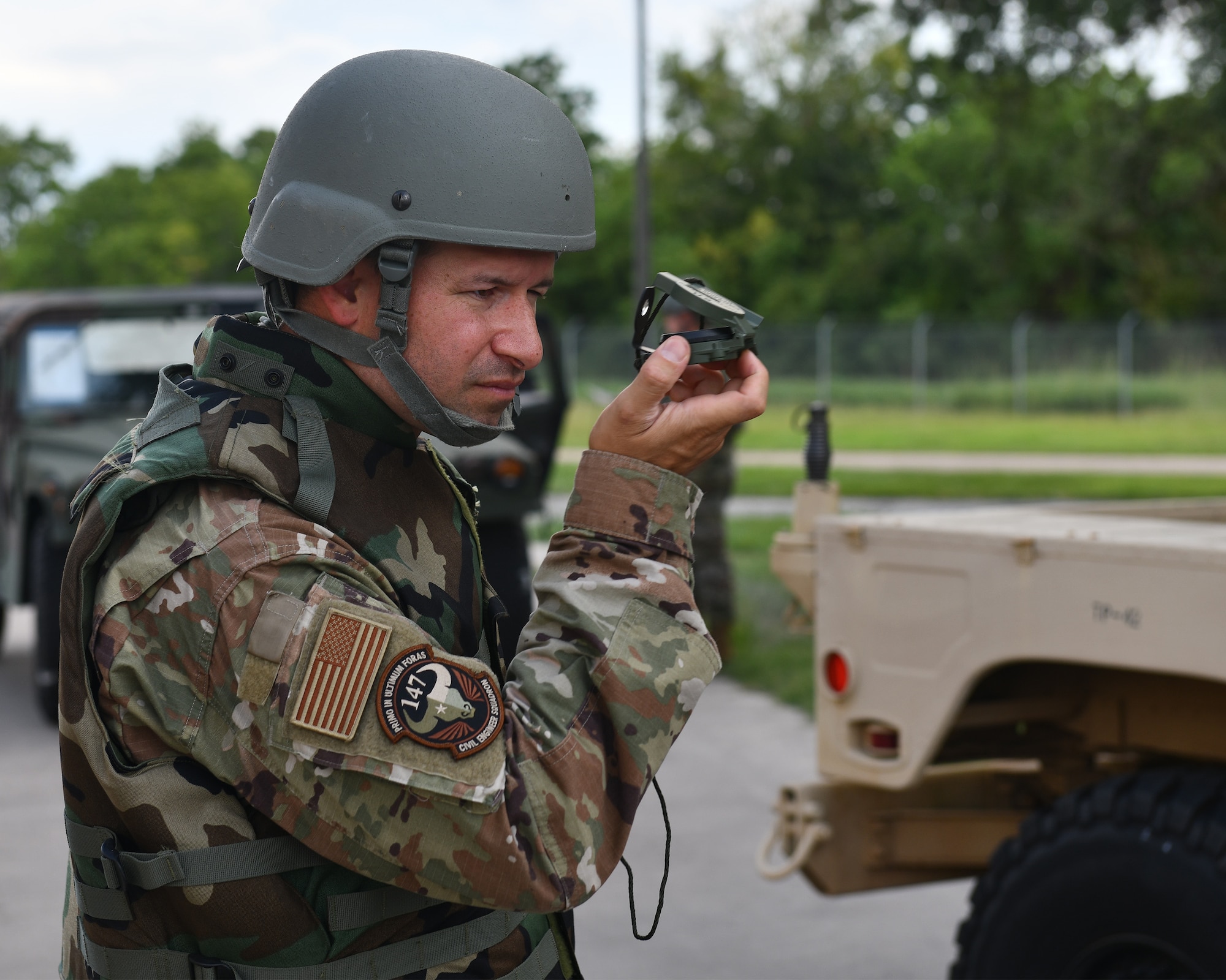 CE Airman uses a compass during an exercise