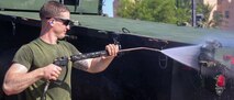 A U.S. Marine with the 26th Marine Expeditionary Unit (MEU), washes a seven-ton truck during an equipment and vehicle wash-down in Aqaba, Jordan, July 6, 2018.