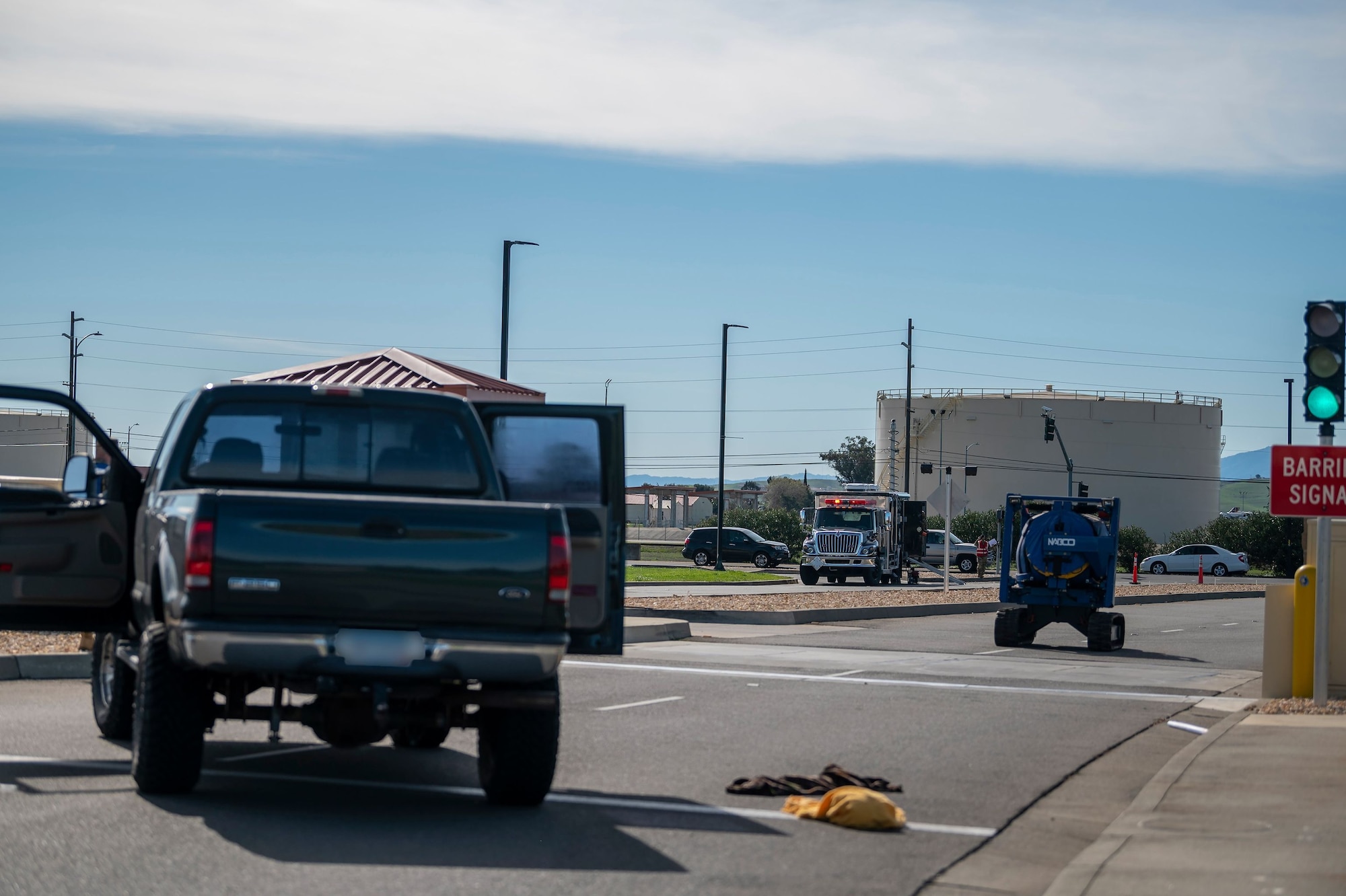 Government vehicles block the roadway during a base readiness exercise, Roundel Galaxia, Feb. 25, 2021, at Travis Air Force Base, California. The base exercise was designed to enhance the capabilities of multiple squadrons in responding to possible real-world situations.(U.S. Air Force photo by Senior Airman Karla Parra)