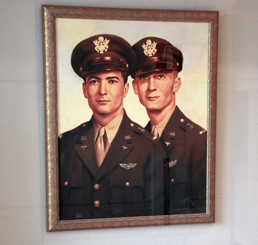 A painting depicts two brothers in uniform standing side by side.