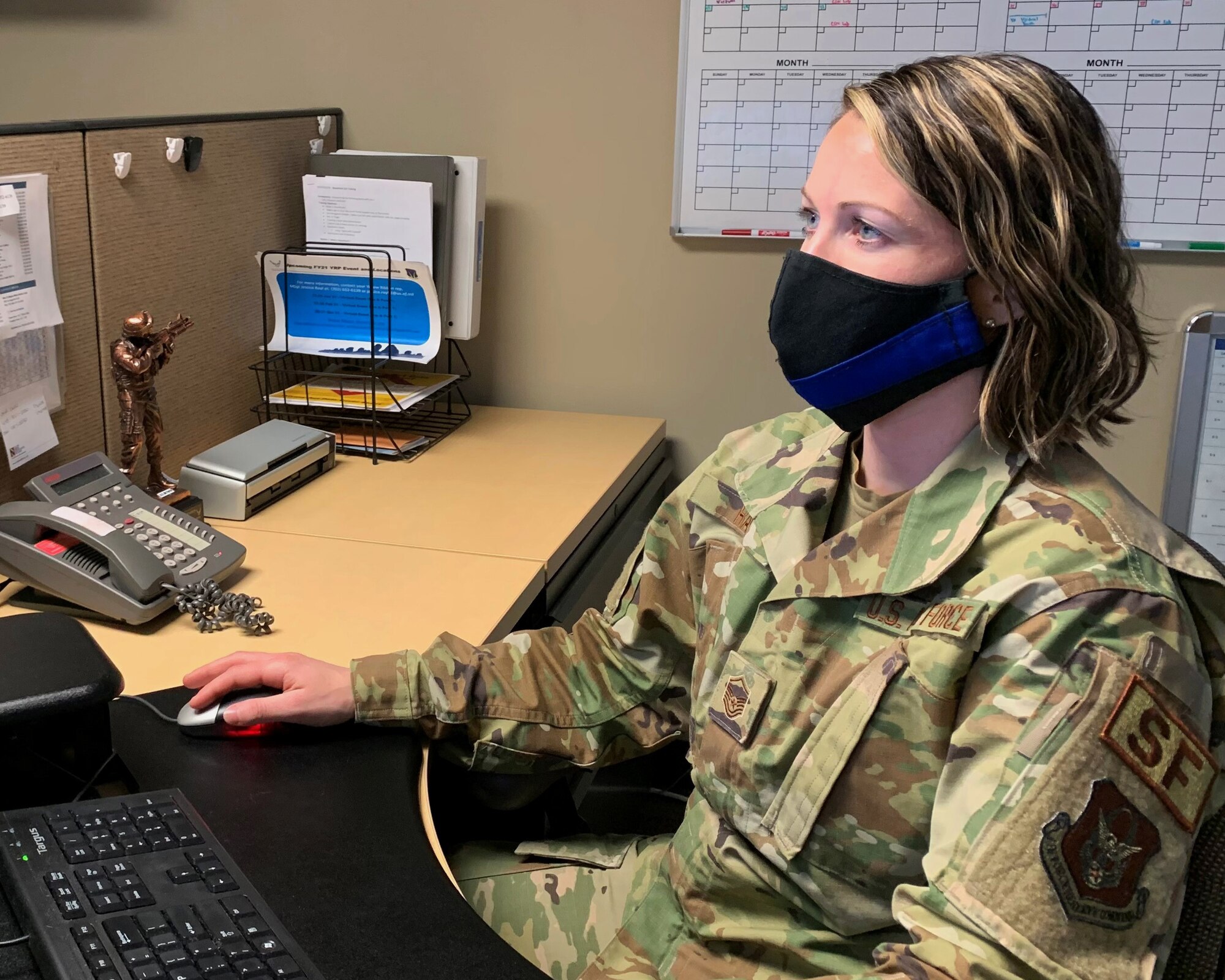 Master Sgt. Jessica Rayl, 926th Wing Yellow Ribbon Reintegration Program representative, works at her desk scheduling wing Reservist for YRRP virtual events.