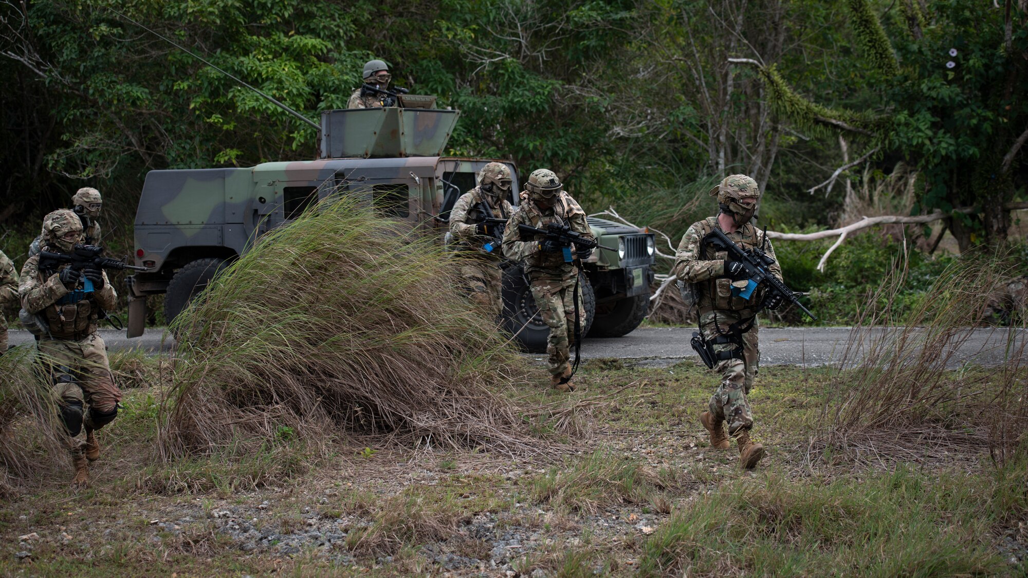 U.S. Airmen from the 644th Combat Communications Squadron take defensive measures against the opposition during Exercise Dragon Shield at Northwest Field, Guam, January 13, 2021.