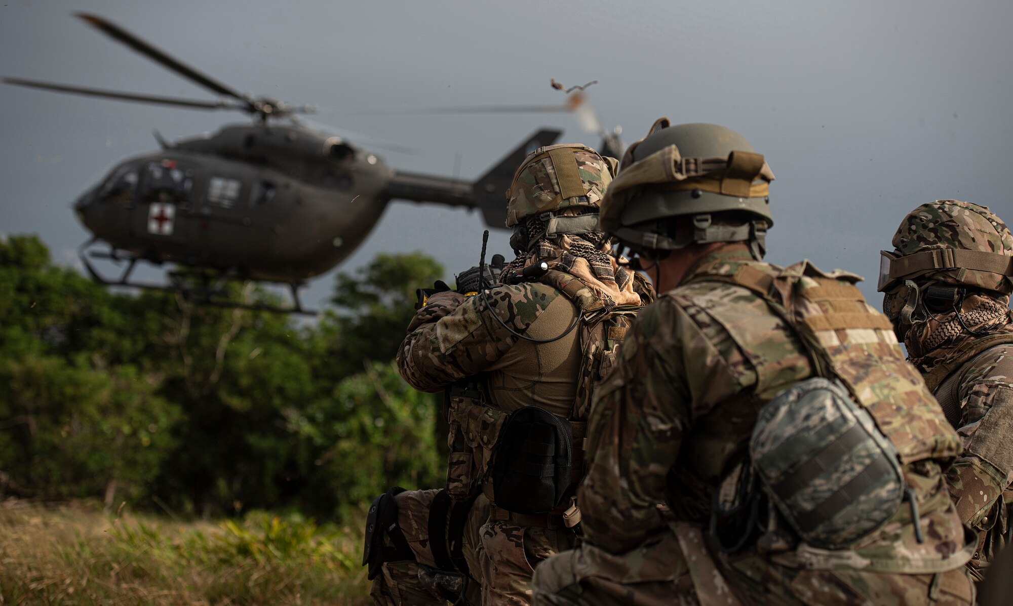 Multi-capable Airmen of the 644th Combat Communications Squadron prepare to assist an emergency airlift with the Guam Army National Guard medical helicopter during Exercise Dragon Shield at Northwest Field, Guam, January 13, 2021.