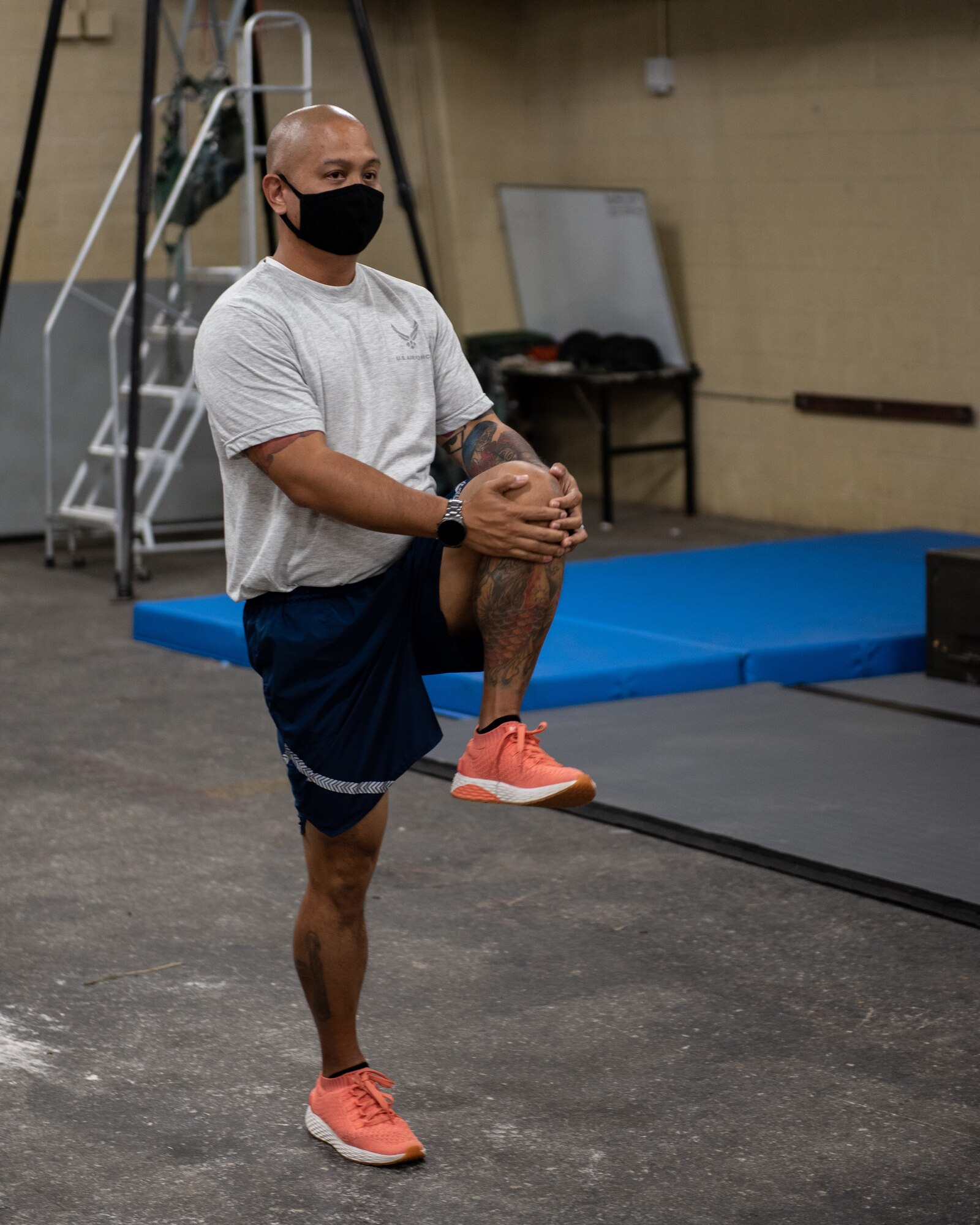 U.S. Air Force Tech Sgt. Joel Andres, Chief of the Health Promotions flight with the 36th Operational Medical Readiness Squadron, demonstrates proper stretching techniques Feb. 23, 2021, at Andersen Air Force Base, Guam.