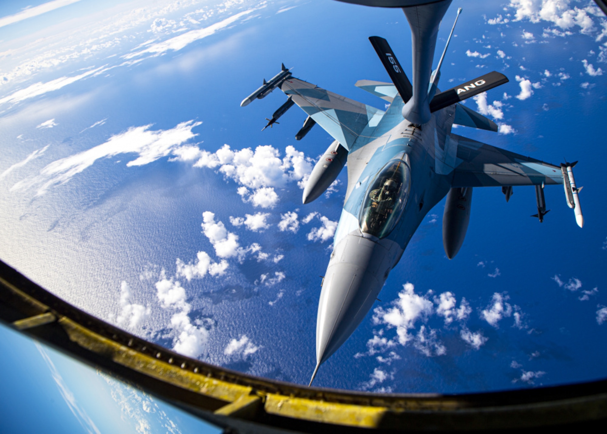 A U.S. Air Force F-16 Fighting Falcon assigned to the 18th Aggressor Squadron conducts an aerial refueling with a U.S. Air Force KC-135 Stratotanker during exercise Cope North 21 near Andersen Air Force Base, Guam, Feb. 18, 2021. (U.S. Air Force photo by Senior Airman Duncan C. Bevan)