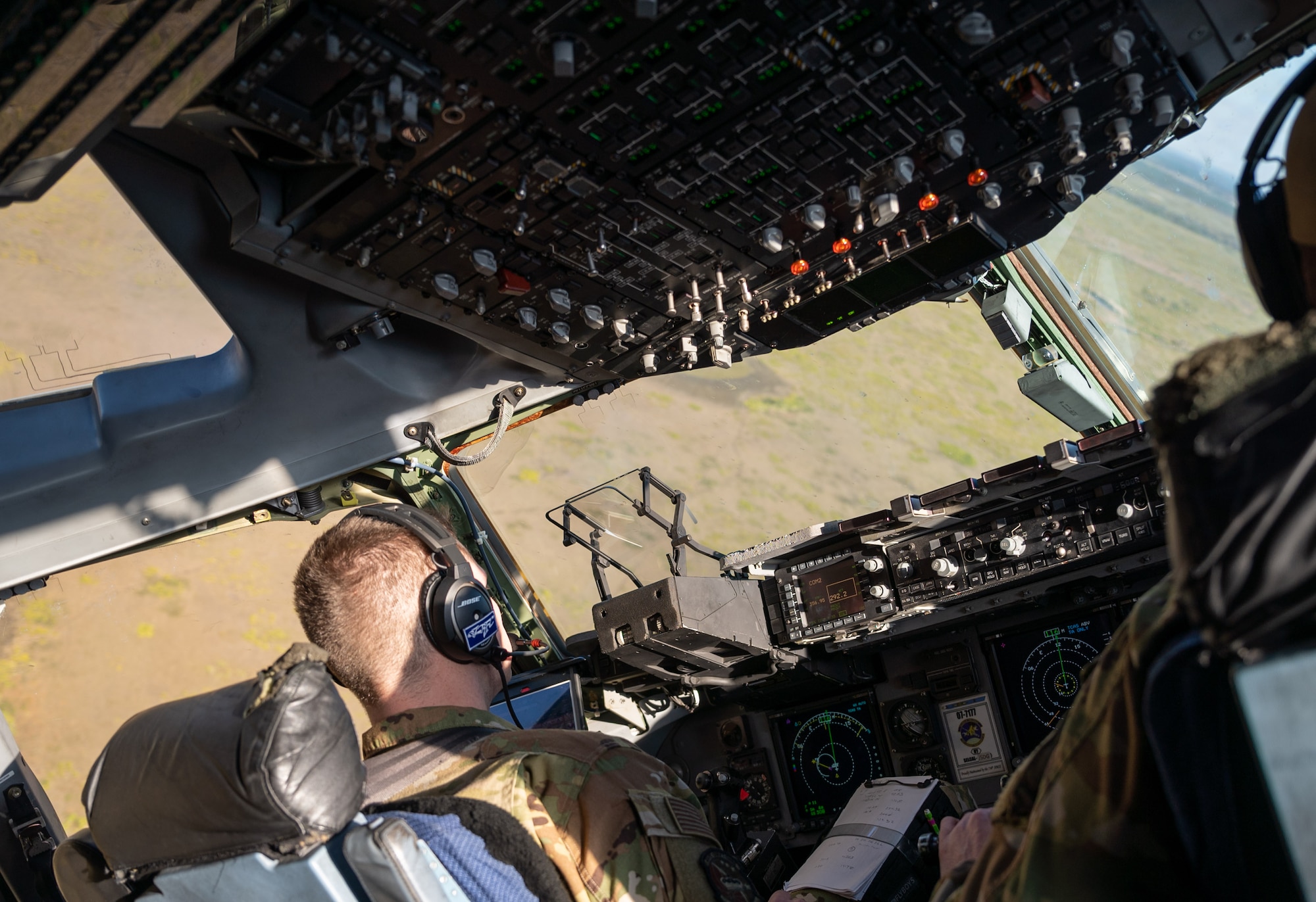 First Lt. August Hein (left), and Capt. Reed Fleming, both 3rd Airlift Squadron pilots, fly a C-17 Globemaster III over Florida during exercise Mosaic Tiger Feb. 25, 2021. Airmen from Dover AFB and Joint Base McGuire-Dix Lakehurst, New Jersey participated in the exercise, led by the 23rd Wing at Moody AFB, Georgia. The exercise tested agile combat employment, across multiple major commands, to build mission-essential skills. (U.S. Air Force photo by Airman 1st Class Faith Schaefer)