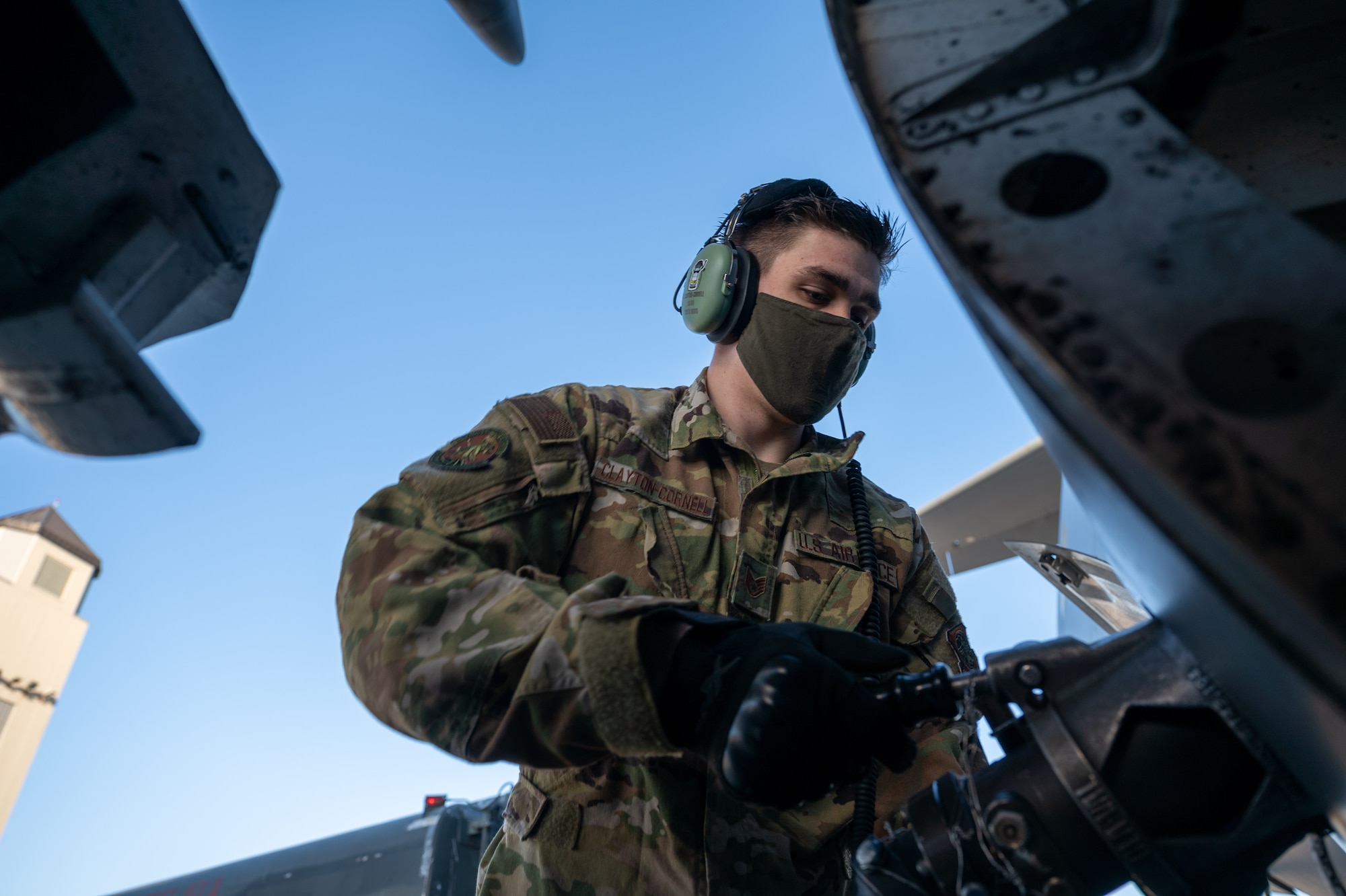 Staff Sgt. Timothy Clayton-Cornell, 736th Aircraft Maintenance Squadron crew chief, Dover Air Force Base, Delaware, attaches a fuel hose to a Dover AFB C-17 Globemaster III during Exercise Mosaic Tiger at Moody AFB, Georgia, Feb. 25, 2021. Airmen from Dover AFB participated in the exercise, testing simulated downrange capabilities to build mission-essential skills to support the needs of Air Combat Command and Air Mobility Command. (U.S. Air Force photo by Airman 1st Class Faith Schaefer)