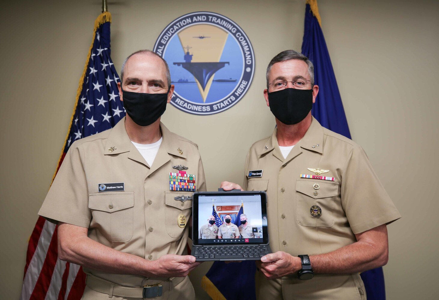 Rear Adm. Pete Garvin, commander, Naval Education and Training Command (NETC), right, and Force Master Chief Matthew Harris, recognize  Chief Aviation Boatswain’s Mate (Handling) Benjamin O’Dea, assigned to Center for Security Forces Detachment North Island, California, as the 2020 MyNavy HR Force Development domain senior enlisted military instructor of the year (MIOY). The NETC MIOY program recognizes Sailors throughout the domain who exhibit attributes, such as sustained superior performance, leadership, mentorship, knowledge and teaching of military history and heritage, self-improvement, command and community involvement, and exemplary military bearing. (U.S. Navy photo by Genevieve McGee)