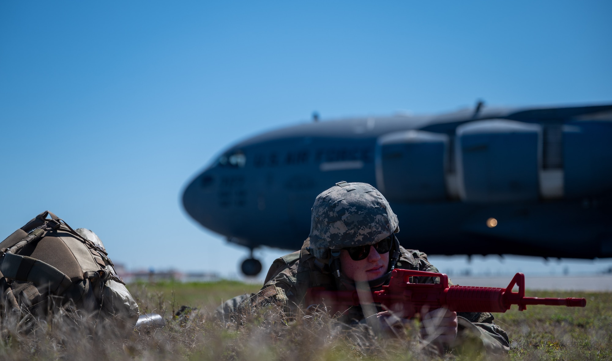 Senior Airman Brandon Hill, 23rd Aircraft Maintenance Squadron crew chief, guards a Dover Air Force Base C-17 Globemaster III during Exercise Mosaic Tiger at Patrick Space Force Base, Florida, Feb. 25, 2021. Mosaic Tiger is an agile combat employment exercise, led by the 23rd Wing, Moody AFB, Georgia, designed to test multi-capable Airmen skills in a simulated downrange environment. Airmen from four different bases, representing two major commands, participated in the exercise that included multiple Air and Space Force installations. (U.S. Air Force photo by Airman 1st Class Faith Schaefer)