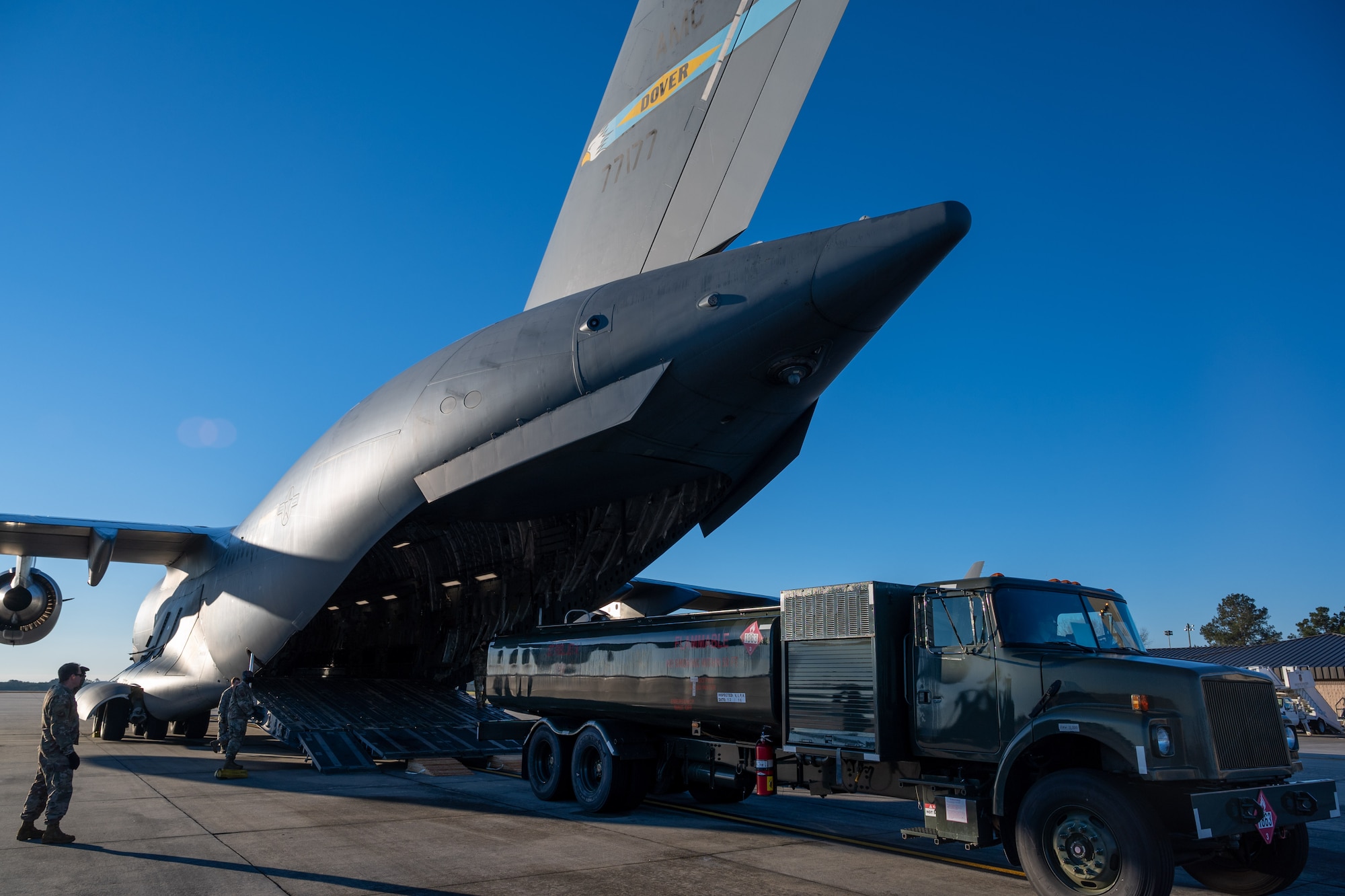 A fuel truck is loaded onto a Dover Air Force Base C-17 Globemaster III during Exercise Mosaic Tiger at Moody AFB, Georgia, Feb. 23, 2021. Mobility Airmen from Dover AFB and Joint Base McGuire-Dix-Lakehurst, New Jersey, participated in the exercise to enhance readiness and reinforce Air Mobility Command support to the joint warfighter. (U.S. Air Force photo by Airman 1st Class Faith Schaefer)