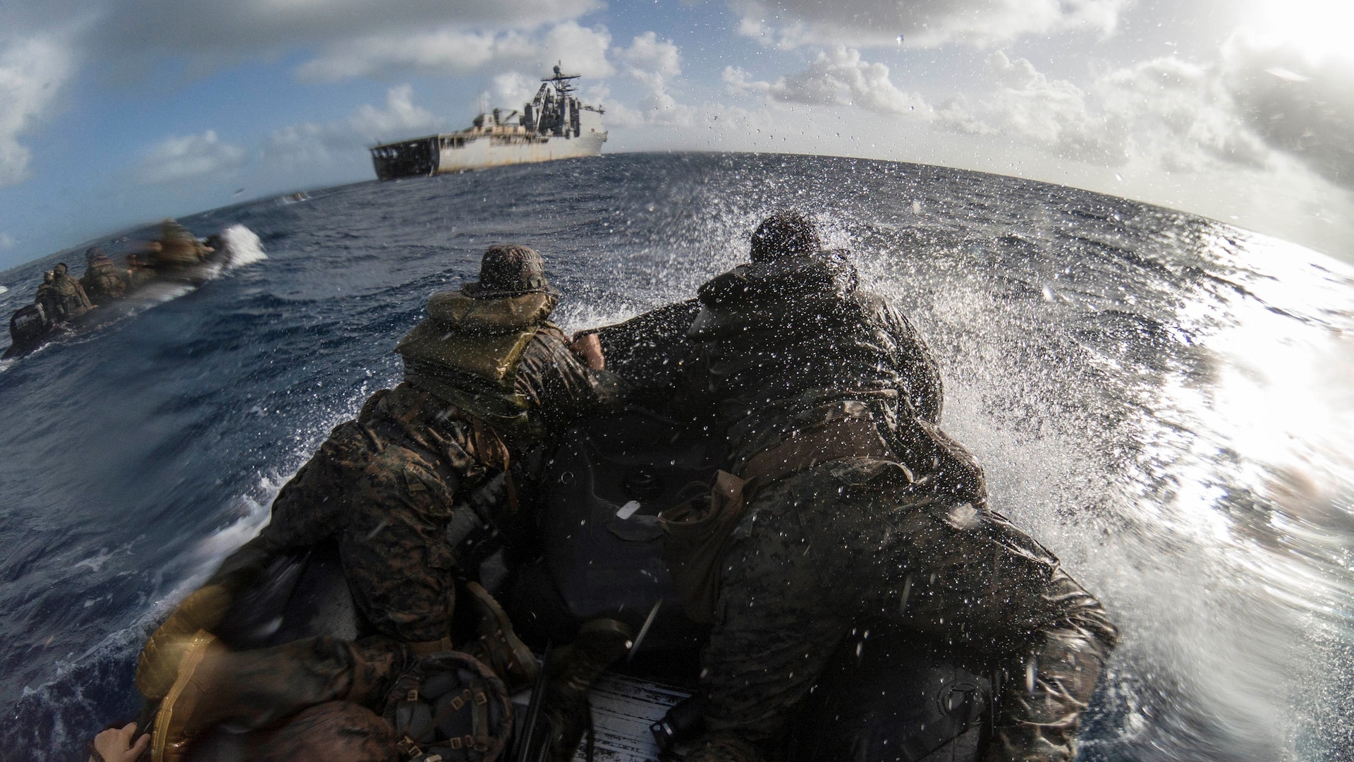 U.S. Marines navigate through water on a combat rubber raiding craft during a boat launch near Peleliu in the Philippine Sea, March 1, 2021.
