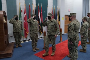 210304-N-KZ419-1004 NAVAL SUPPORT ACTIVITY BAHRAIN (March 4, 2021) - Capt. Oscar Rojas, incoming commanding officer of Commander, Task Force (CTF) 52, renders a salute while passing the sideboys during a change of command ceremony onboard Naval Support Activity Bahrain, March 4. CTF 52 strengthens national and coalition mine countermeasures capabilities and capacity in order to promote a secure maritime environment in the U.S. Central Command area of responsibility. (U.S. Navy photo by Mass Communication Specialist 3rd Class Dawson Roth)