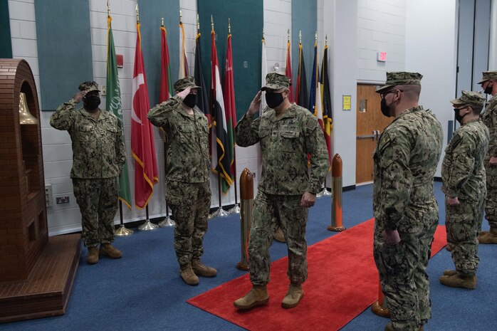 210304-N-KZ419-1004 NAVAL SUPPORT ACTIVITY BAHRAIN (March 4, 2021) - Capt. Oscar Rojas, incoming commanding officer of Commander, Task Force (CTF) 52, renders a salute while passing the sideboys during a change of command ceremony onboard Naval Support Activity Bahrain, March 4. CTF 52 strengthens national and coalition mine countermeasures capabilities and capacity in order to promote a secure maritime environment in the U.S. Central Command area of responsibility. (U.S. Navy photo by Mass Communication Specialist 3rd Class Dawson Roth)