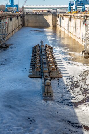 Dry Dock 8 is being flooded for the arrival of a U.S. Navy vessel.