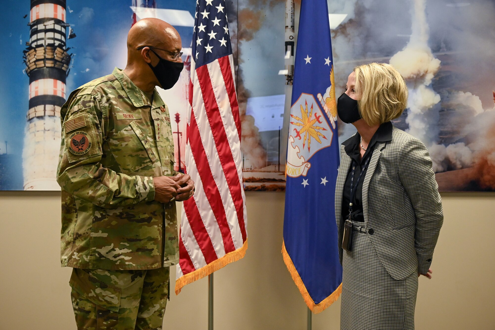 Air Force Chief of Staff Gen. Charles Q. Brown, Jr. speaks with Jarie MIckelson, GBSD deputy system program manager, before presenting her with a coin during a visit to Hill Air Force Base, Utah, March 2, 2021.