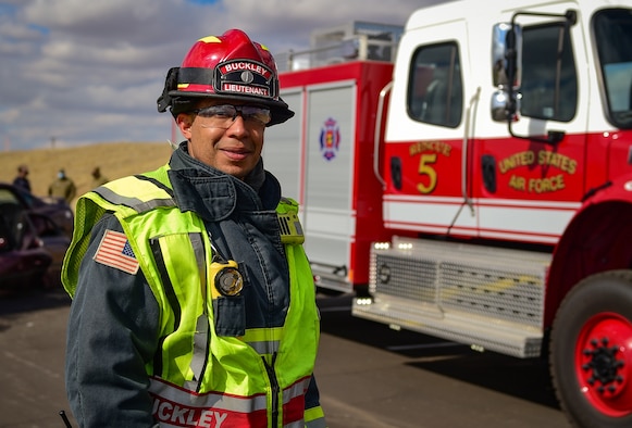 Fire Lt. Isaiah C. Draper, a firefighter with the 460th Civil Engineer Squadron, poses in front of the new Heavy Rescue truck before an auto extraction exercise on Buckley Air Force Base, Colo., Feb. 24, 2021.