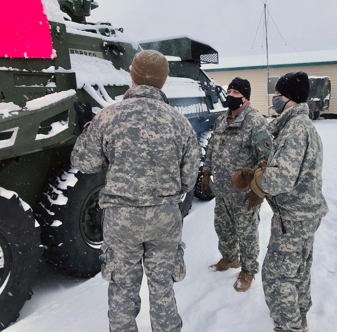 A medic from Role 1, 1st Stryker Brigade Combat Team, 25th Infantry Division, Master Sgt. David Edwards, ACM-AHS; and a medic from Role 1, 1st Stryker Brigade Combat Team, 25th Infantry Division, conduct an assessment on M1133 Stryker medical evacuation vehicle in extreme cold weather at Fort Greely, Alaska.