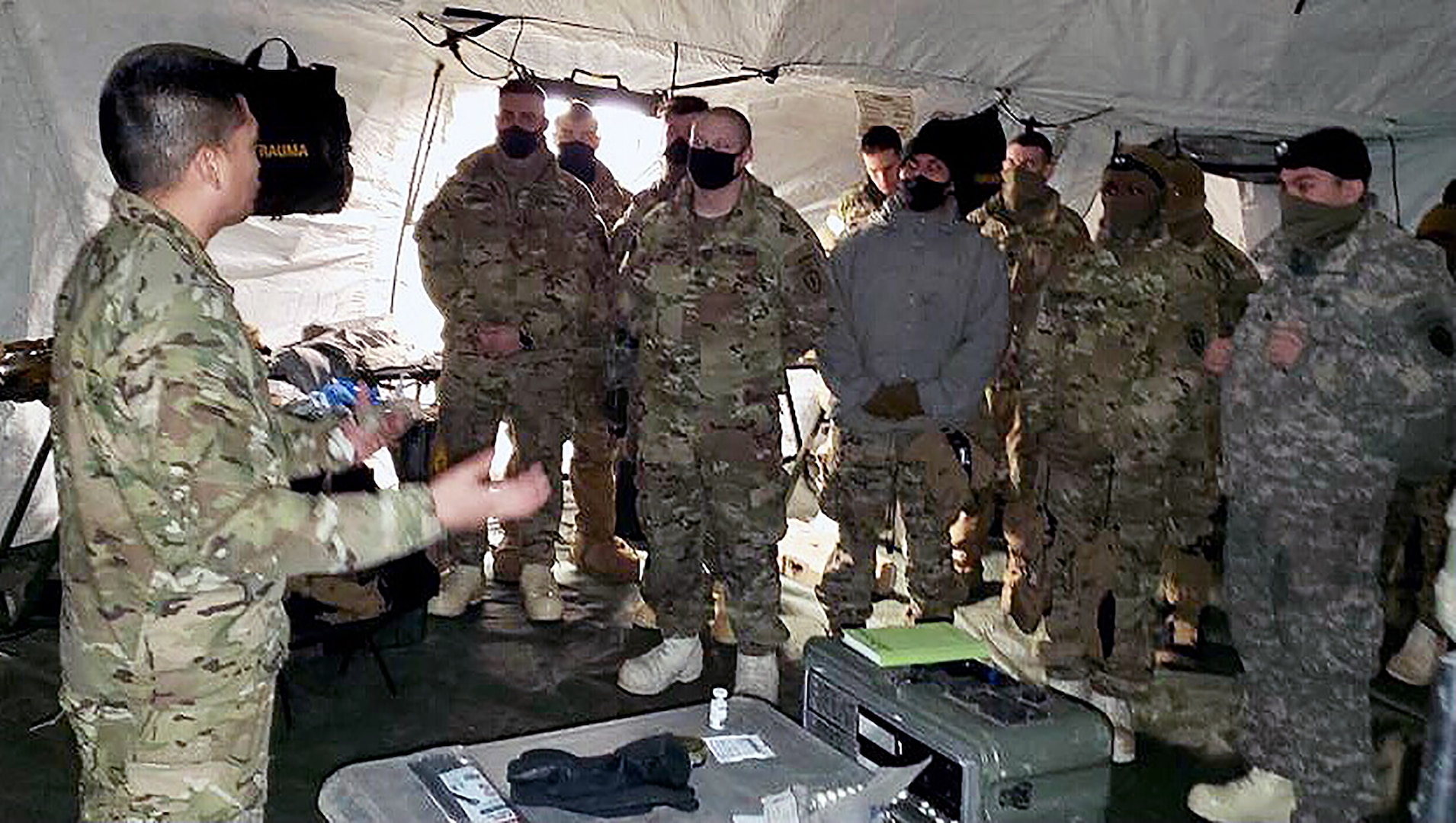 Col. Joselito Lim and Role 2 medical personnel from 4th Brigade 25th Infantry Division address medical personnel at Role 2 on Army Capability Manager-Army Health System at Fort Greely, Alaska.