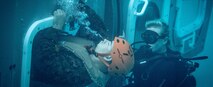A Marine with the 11th Marine Expeditionary Unit (11th MEU) is observed by a safety diver, escaping the Modular Amphibious Egress Trainer during underwater egress training at Camp Pendleton, Calif., Oct. 12, 2018.