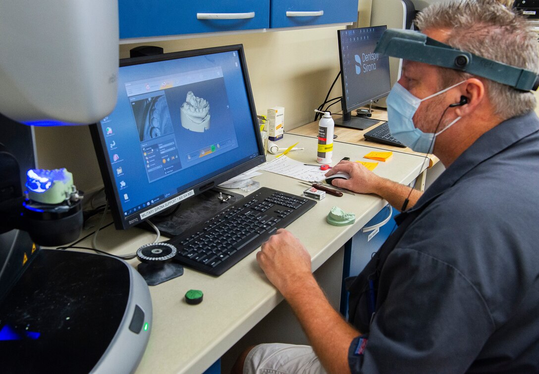 Rick Usserman, 88th Dental Squadron dental laboratory technician, scans a cast as part of making a patient’s crown Feb. 22, 2021, in the dental clinic lab at Wright-Patterson Air Force Base, Ohio. Dental assistants and technicians perform a wide assortment of jobs, ranging from checking in patients and taking X-rays to assisting with procedures and creating prosthetics. (U.S. Air Force photo by R.J. Oriez)
