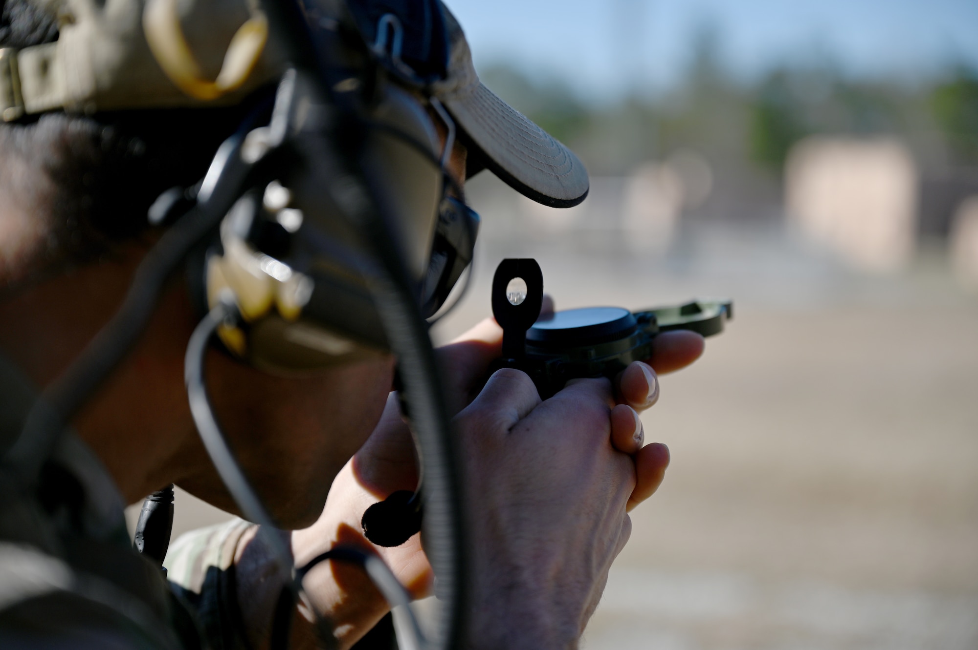 A U.S. Air Force Special Tactics operator assigned to the 24th Special Operations Wing finds a directional heading while surveying an exercise mission zone during Emerald Warrior 21.1, Feb. 22, 2021, at Camp Shelby, Mississippi. Emerald Warrior is the largest joint special operations exercise involving U.S. Special Operations Command forces training to respond to various threats across the spectrum of conflict. (U.S. Air Force photo by Staff Sgt. Ridge Shan)