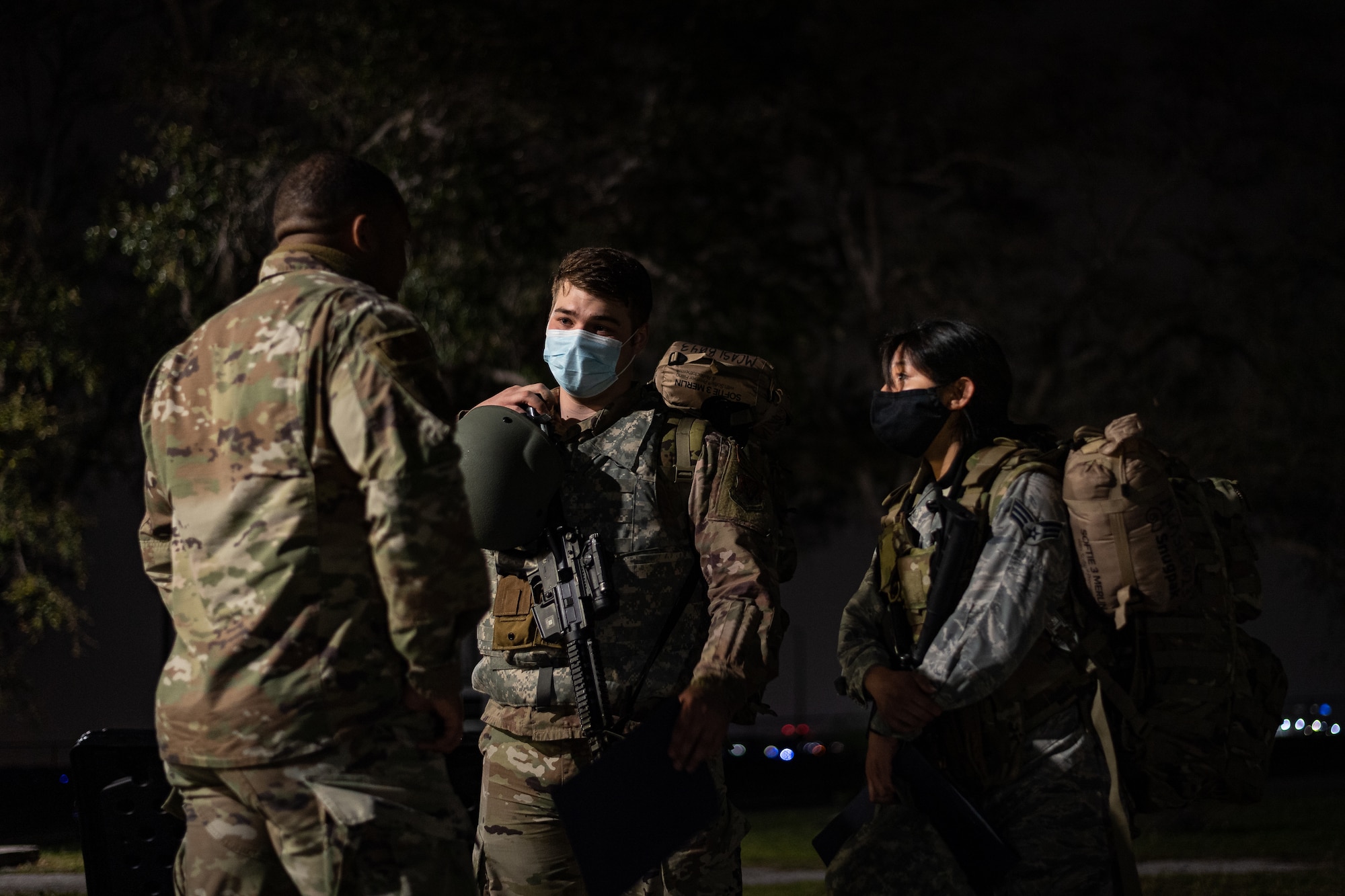 Photo of an Airman speaking to another Airman