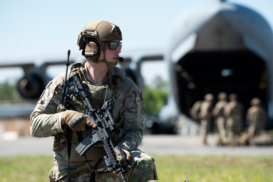 Photo of an Airman securing an airfield perimeter