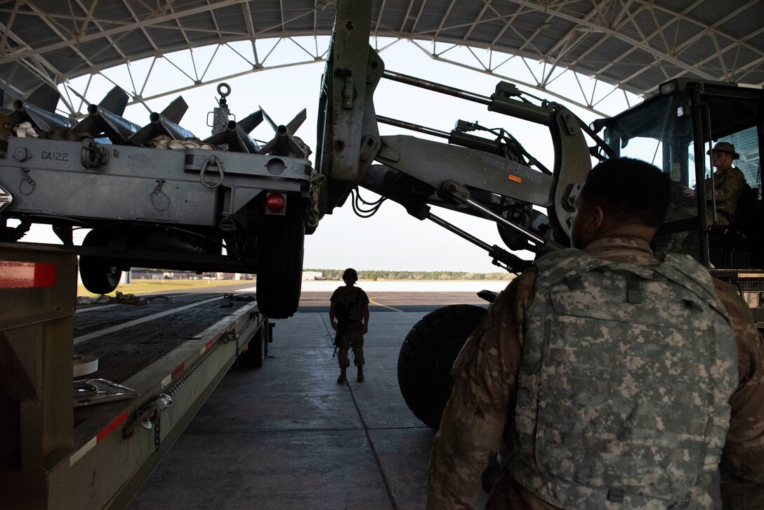 Photo of an Airman offloading bombs