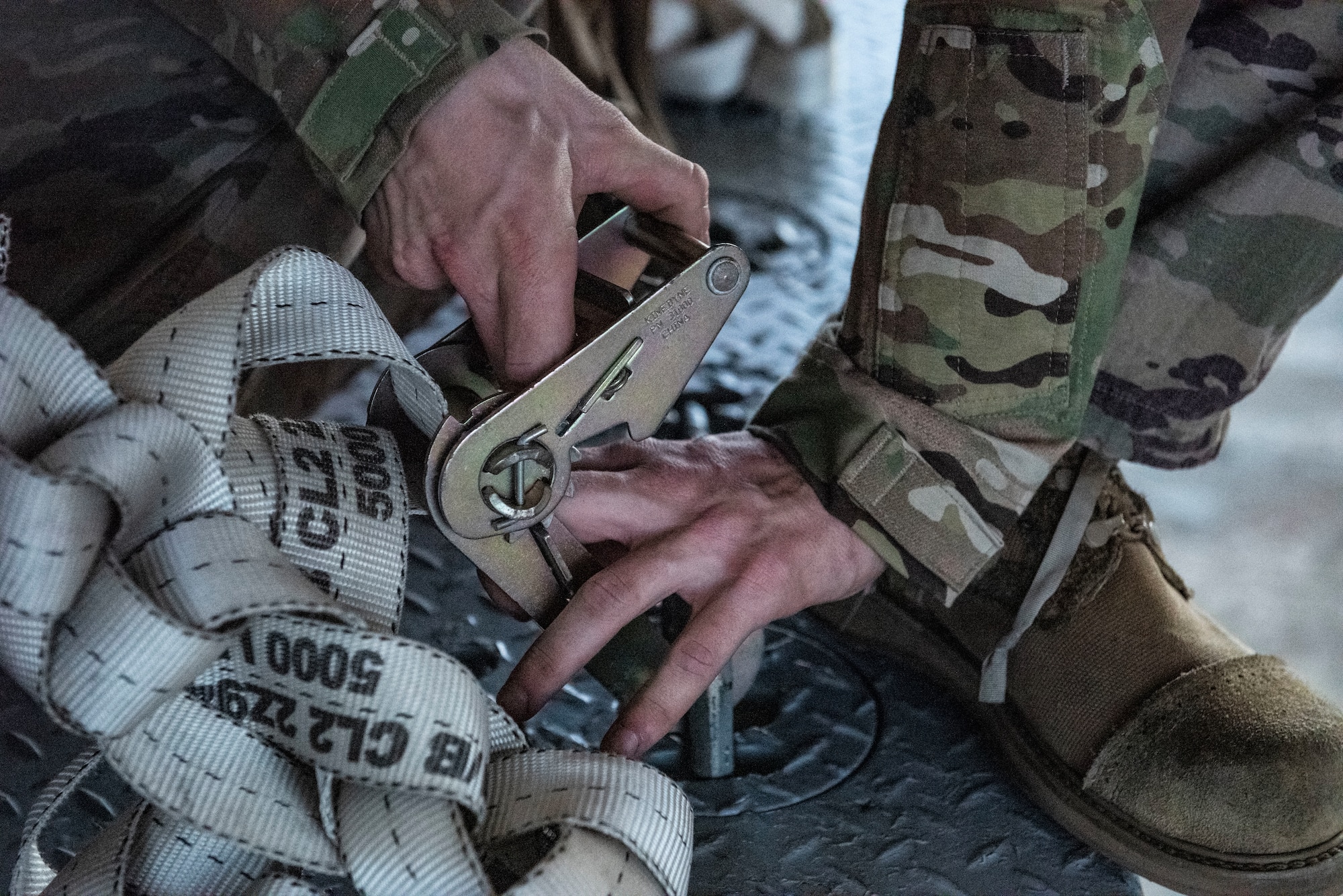 Photo of an Airman releasing a strap